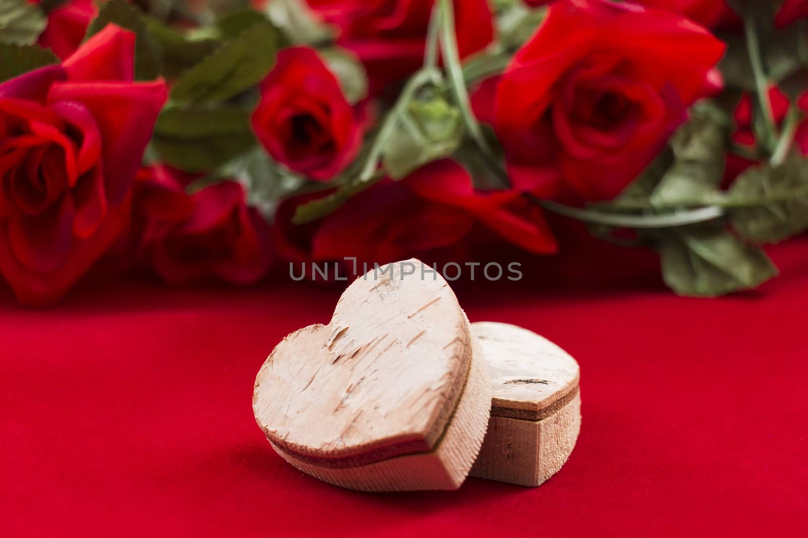 Two hearts  with roses in the background by snowwhite