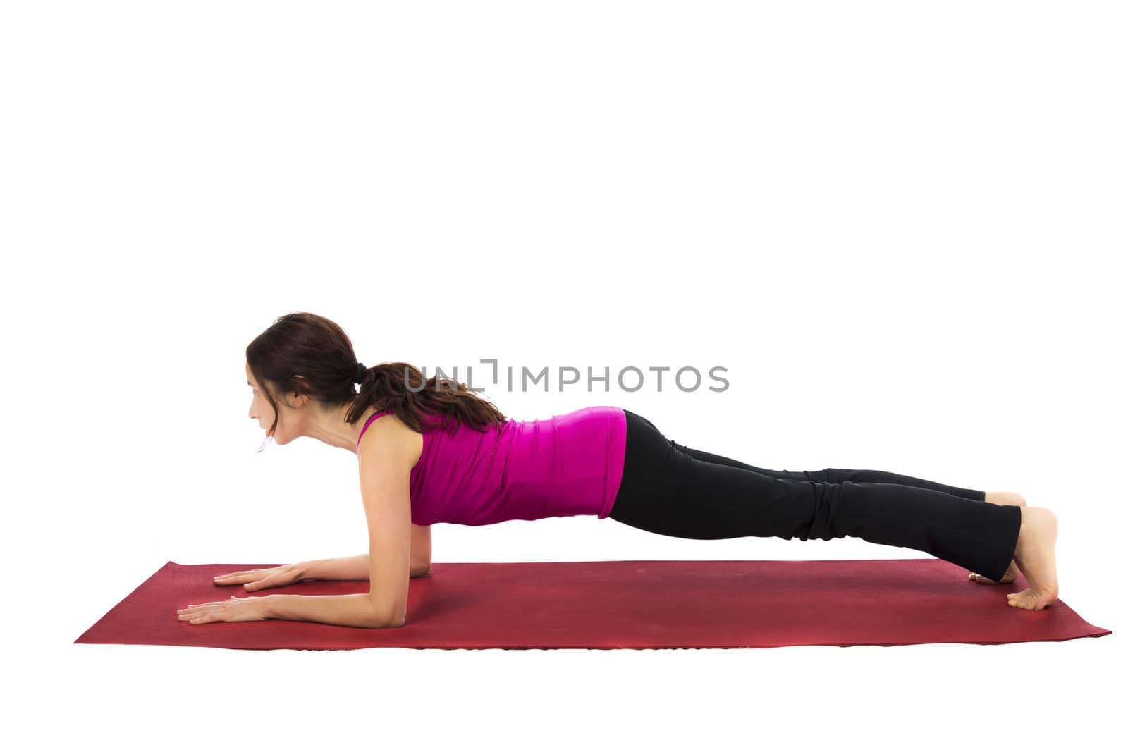 Young woman doing in Forearm Plank in Yoga