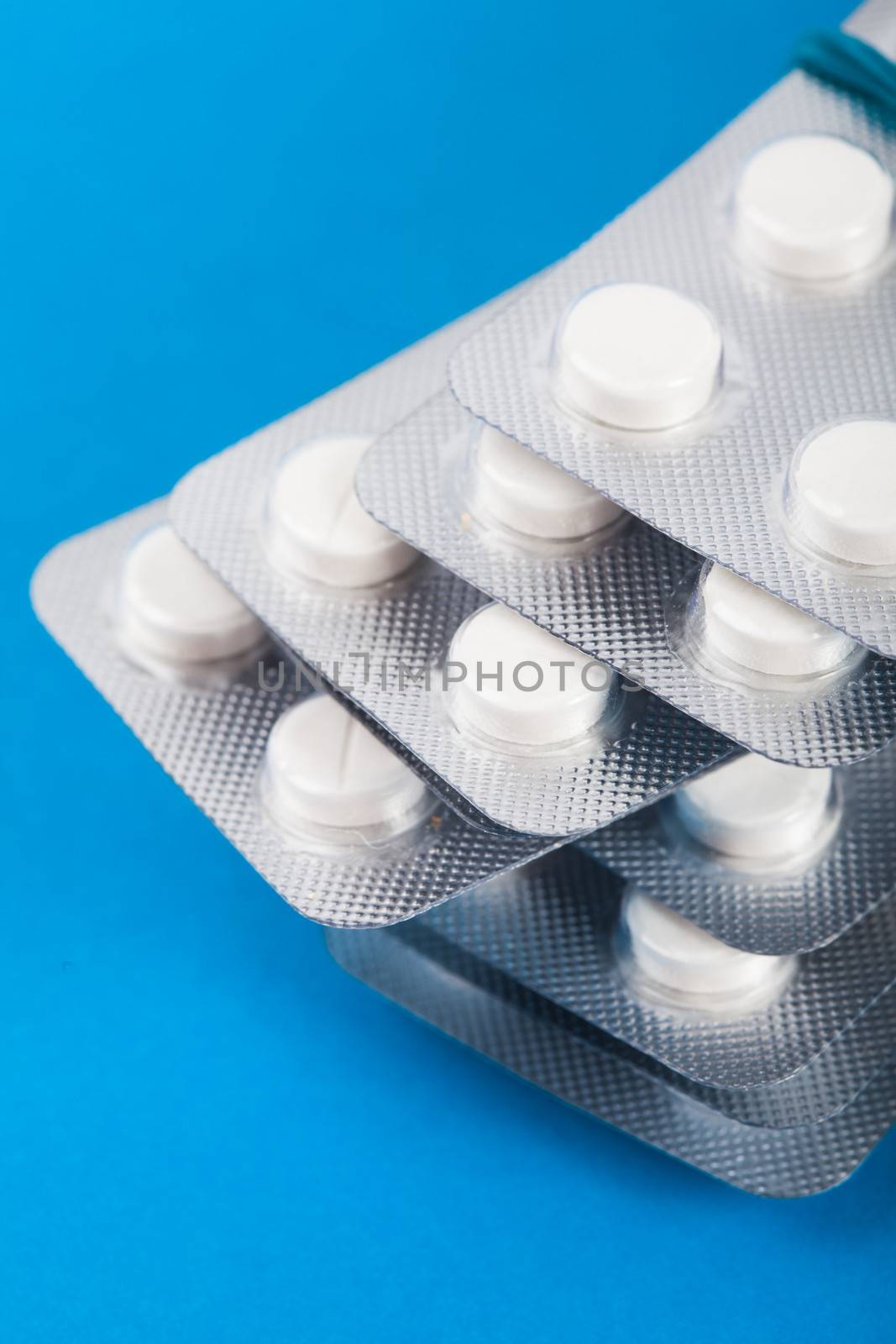 The variety of tablets in packs on white background