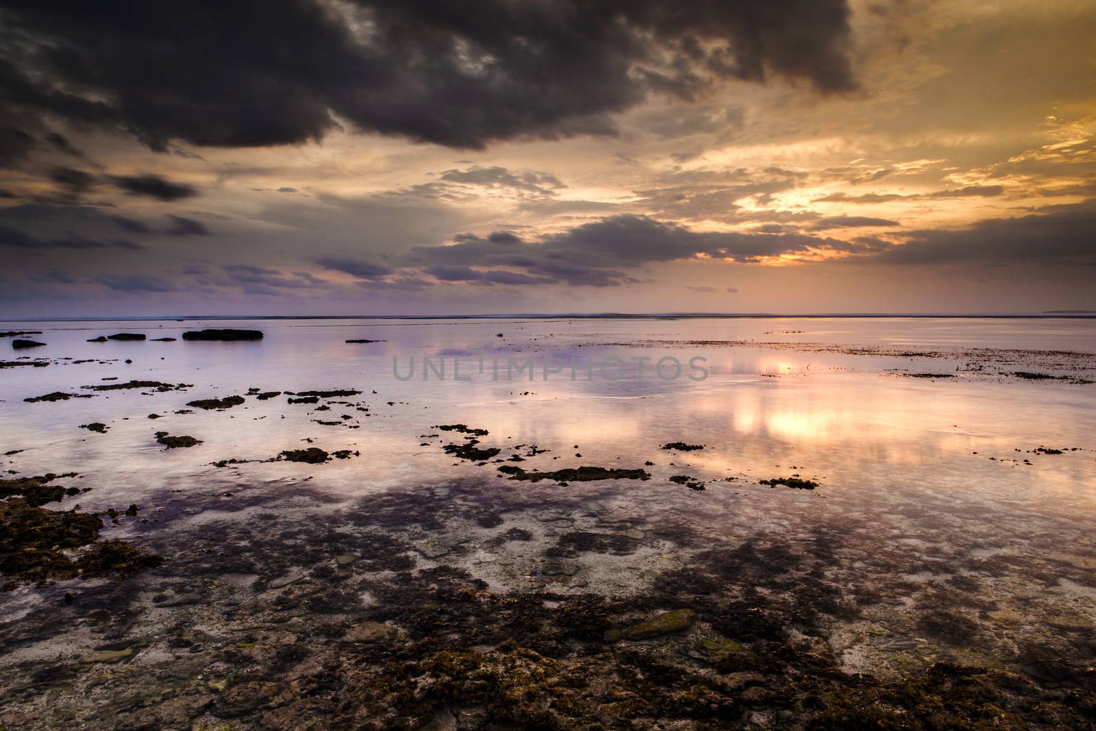 Beautiful landscape picture from a beach in Indonesia at sunset