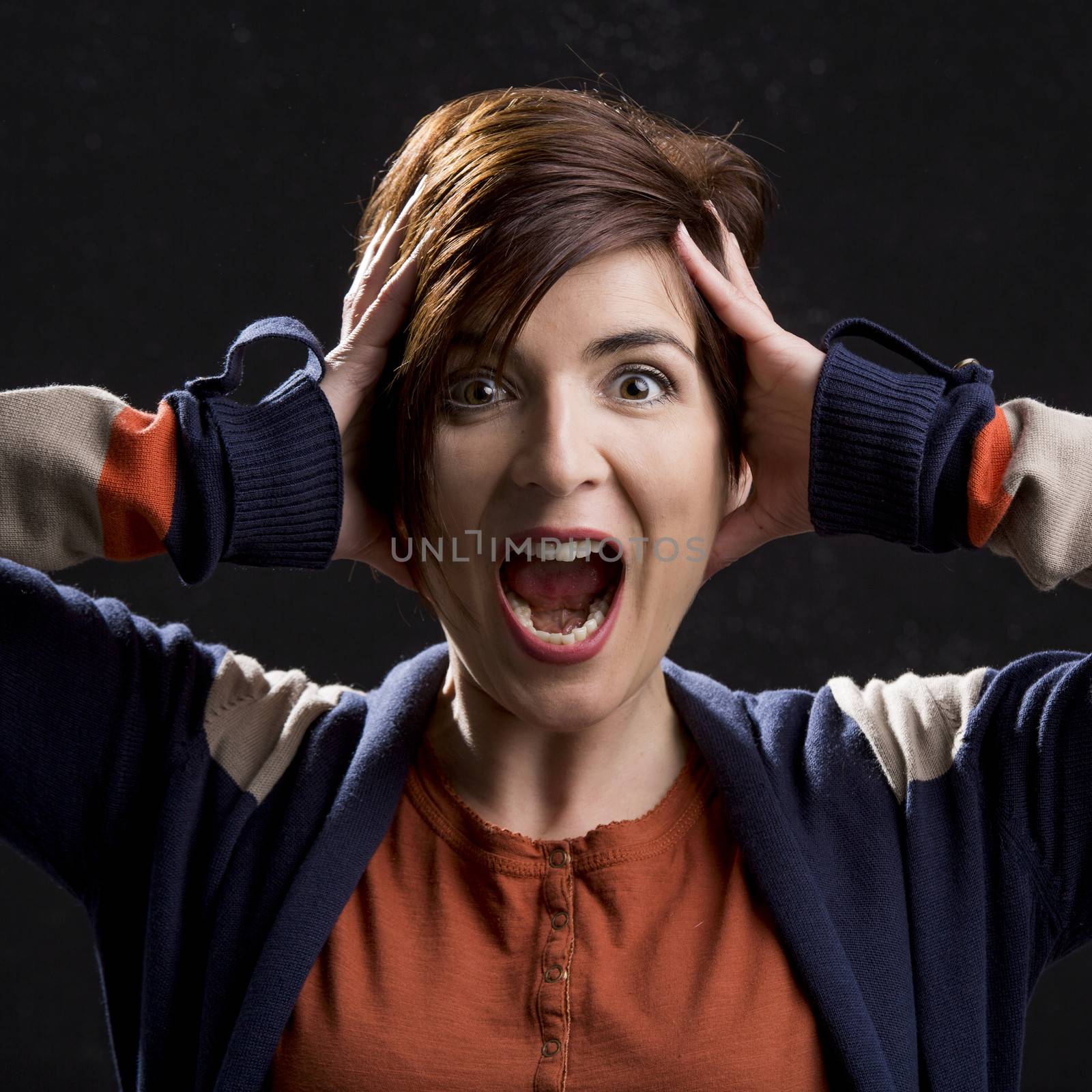 Woman yelling with hands on the head