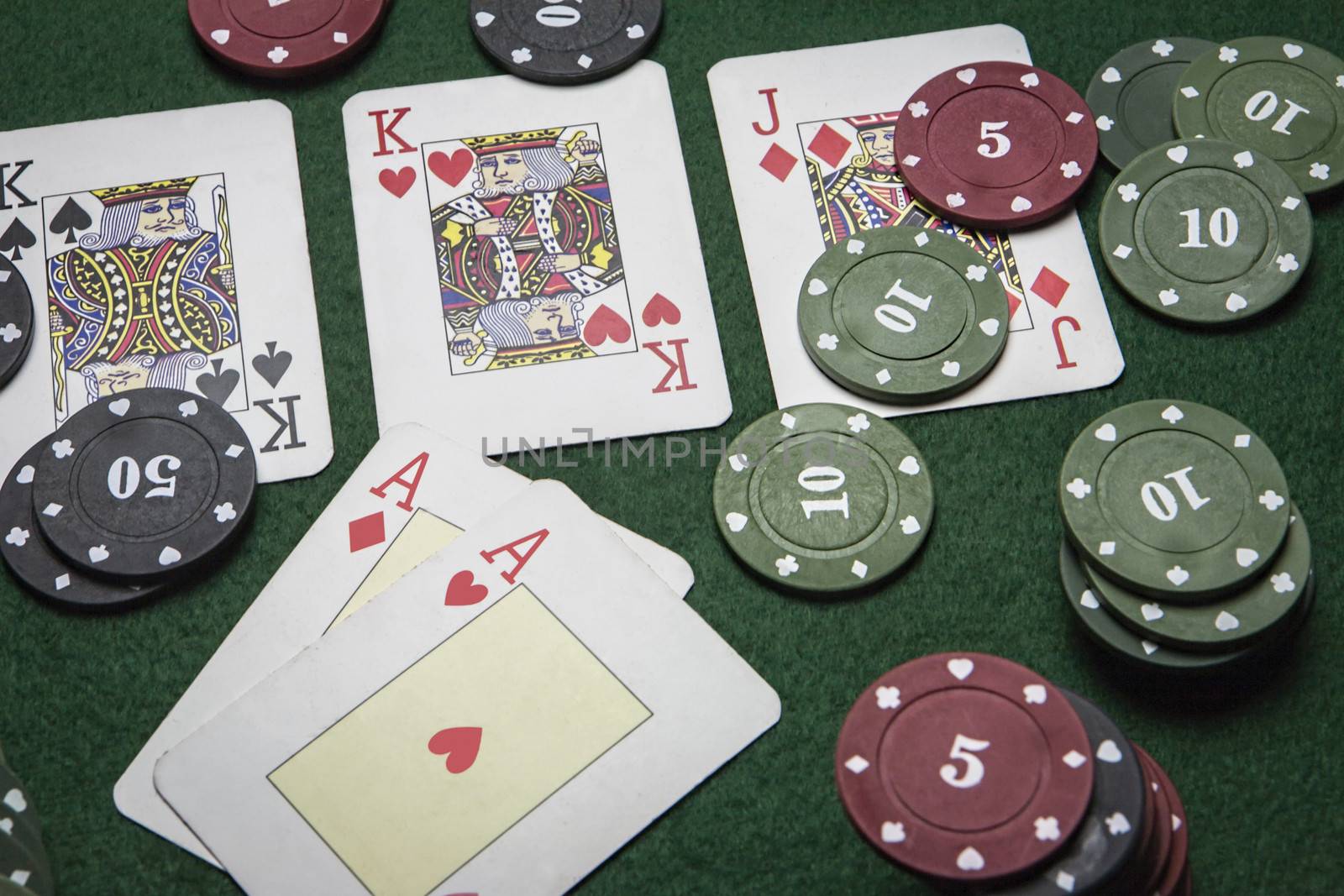 cards poker deck English, poker chips stack on green table 