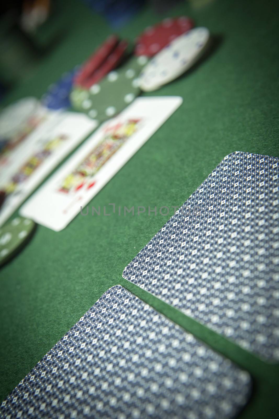 cards poker deck English, poker chips stack on green table  by digicomphoto