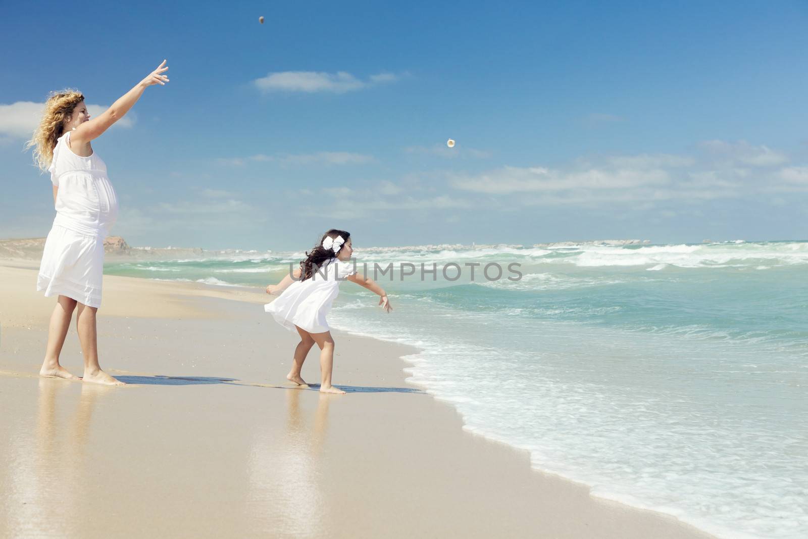 Modher and daughter throwing stones by Iko