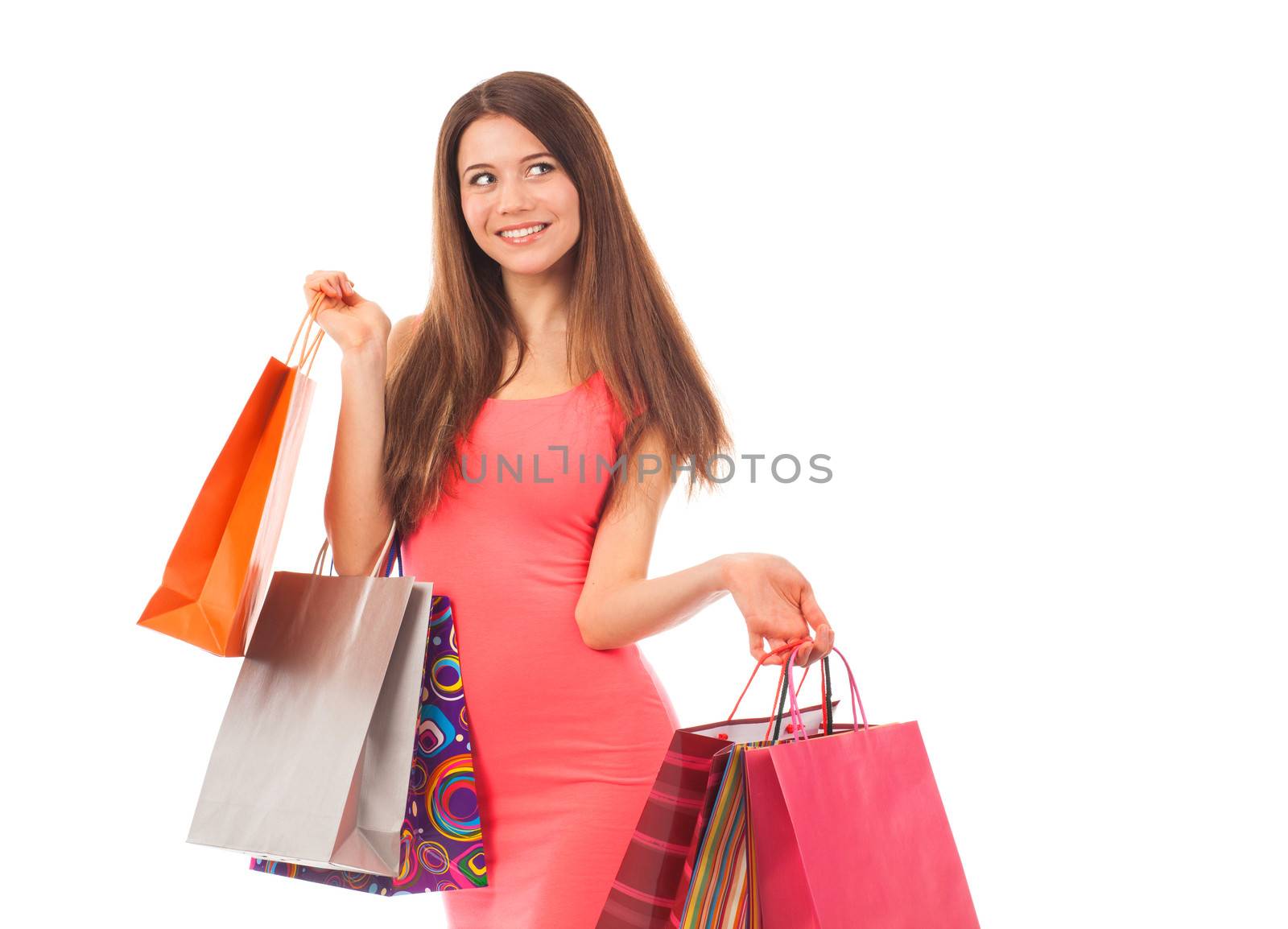 Pretty woman shopping, holding shopping bags, isolated on white
