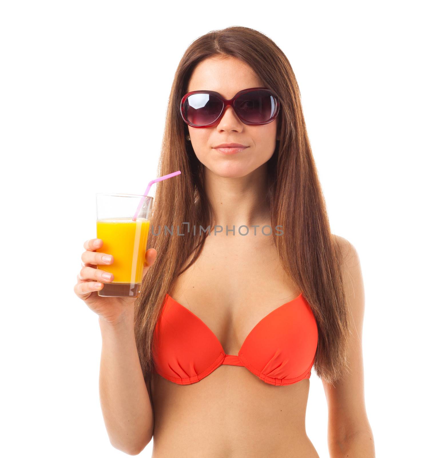 Young beauty in summer
Woman with sunglasses drinks orange juice in summer, isolated on white