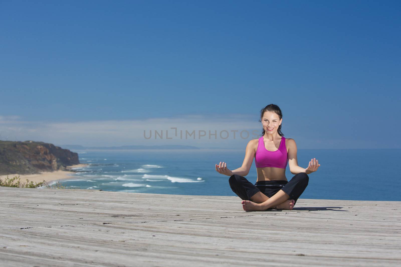 Beautiful young woman in outdoor doing yoga