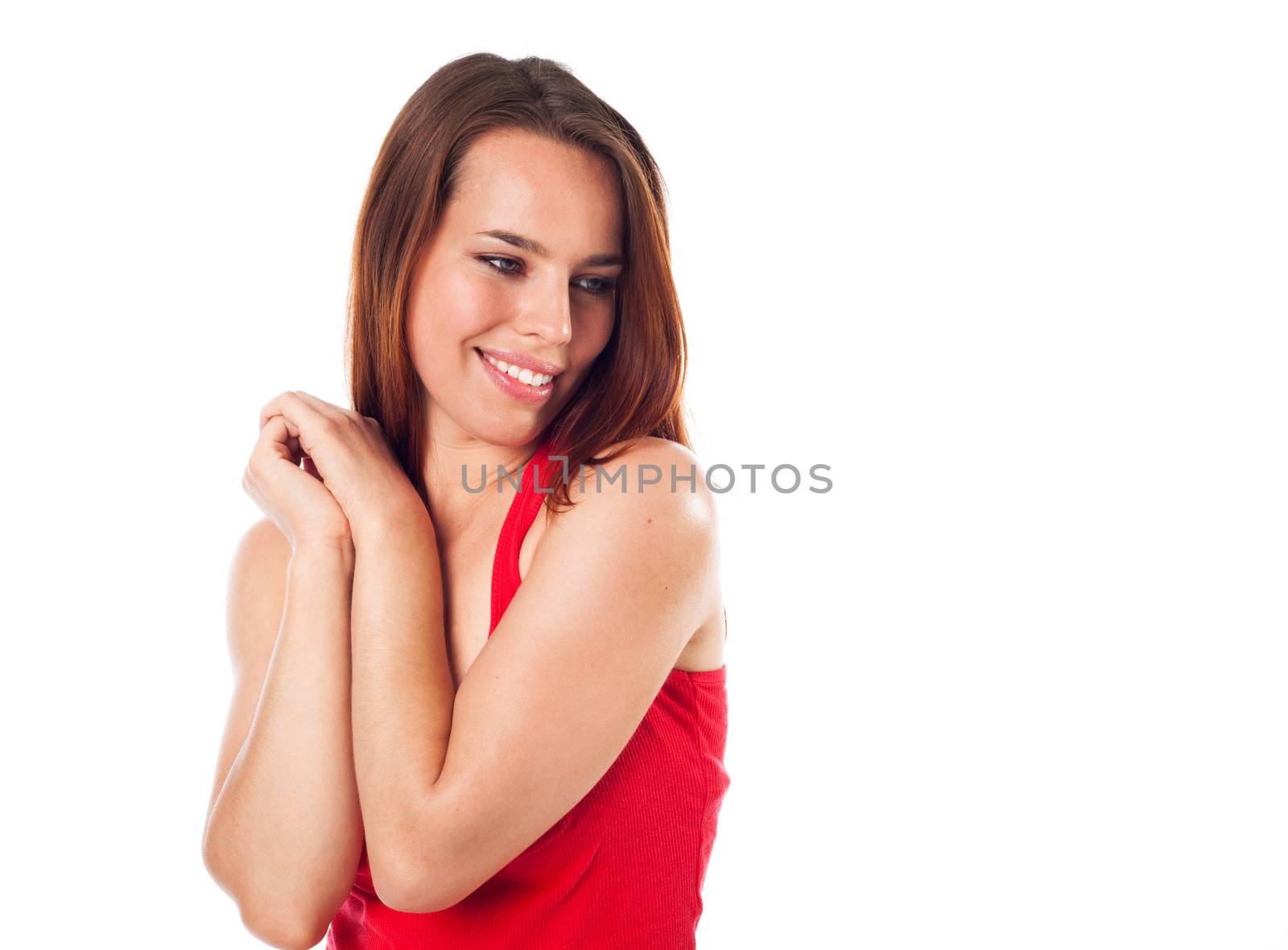 Nice young woman looking something down and smiling, isolated on white