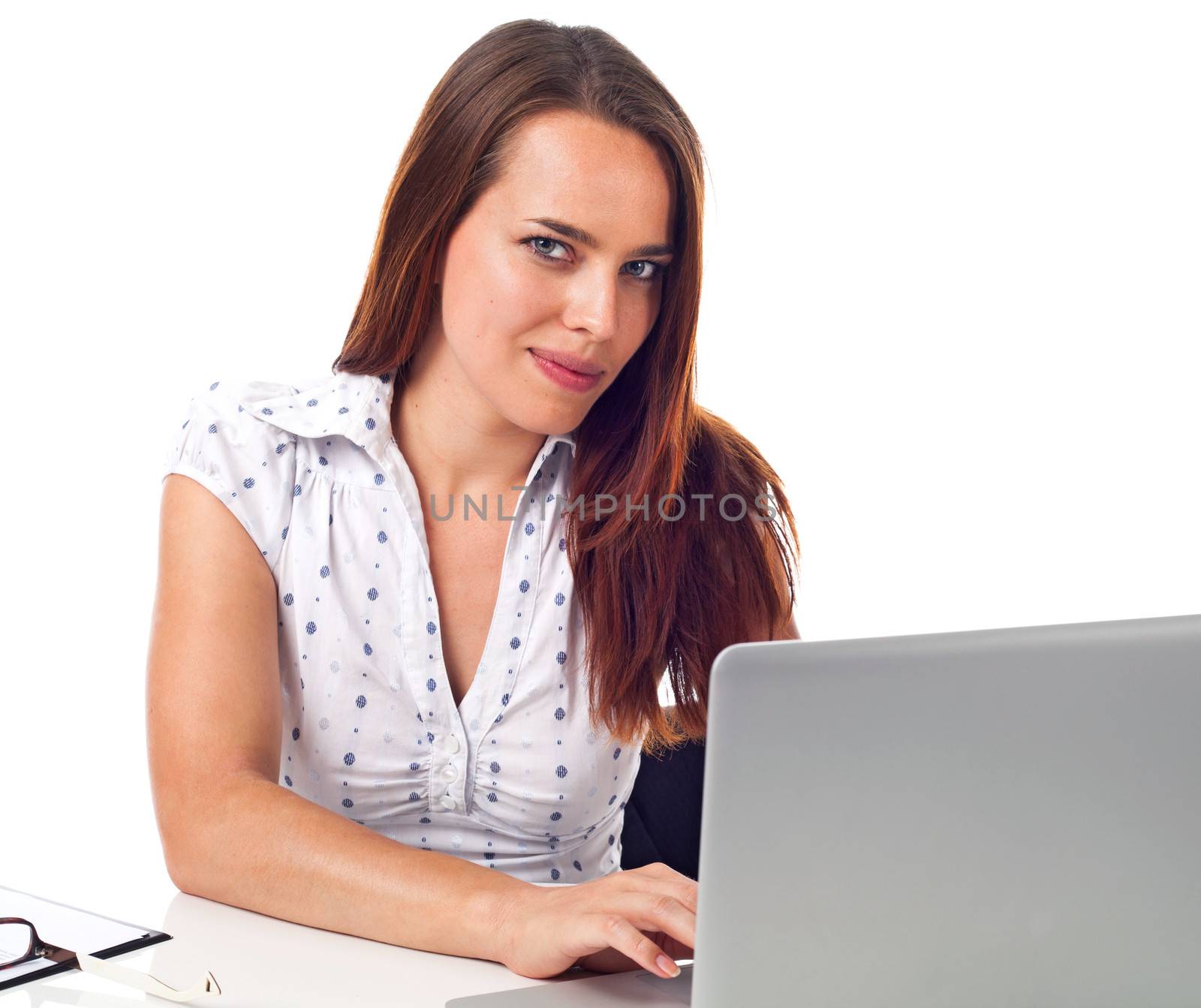 Pretty woman working on laptop, isolated on white 