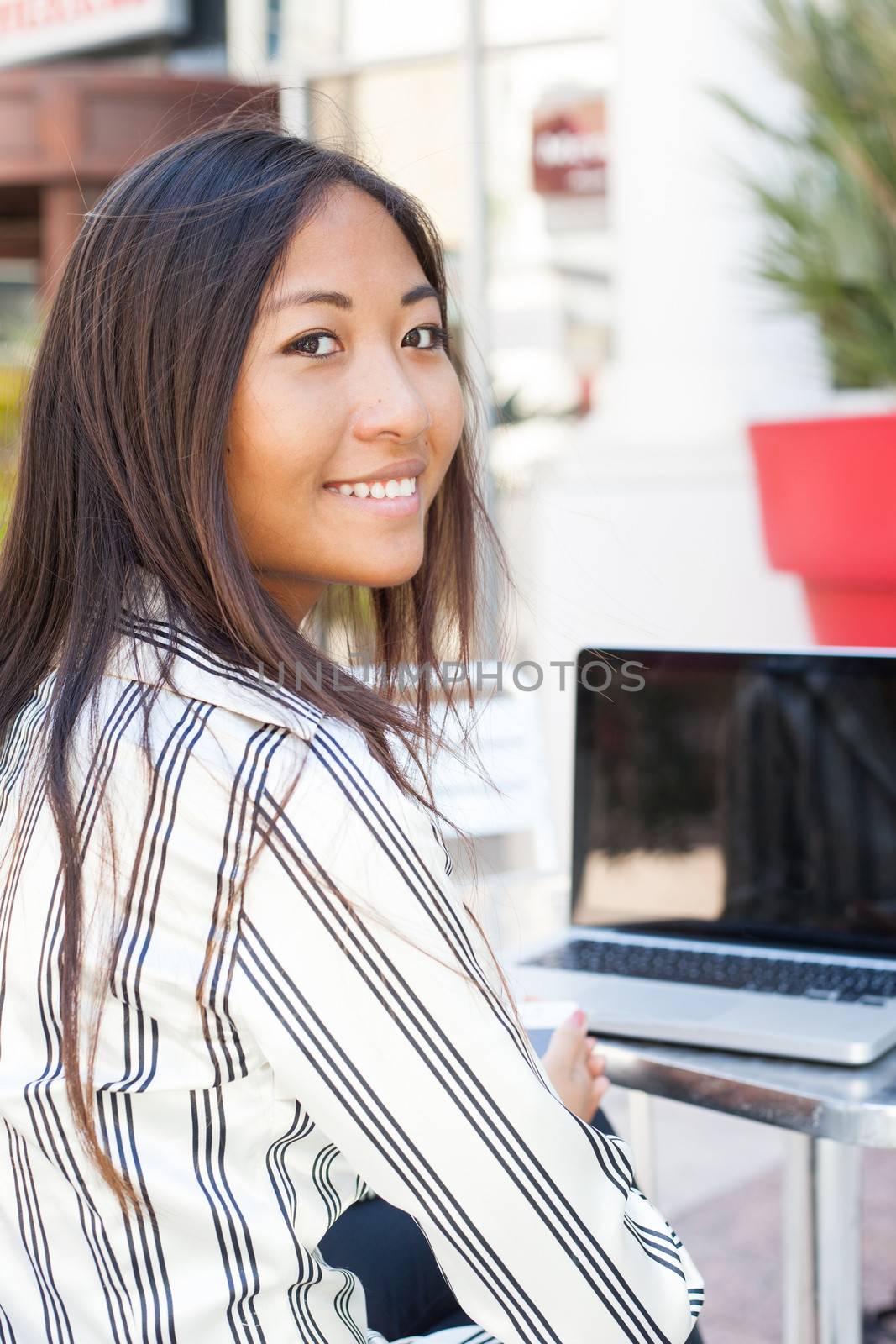 Asian girl and laptop by TristanBM