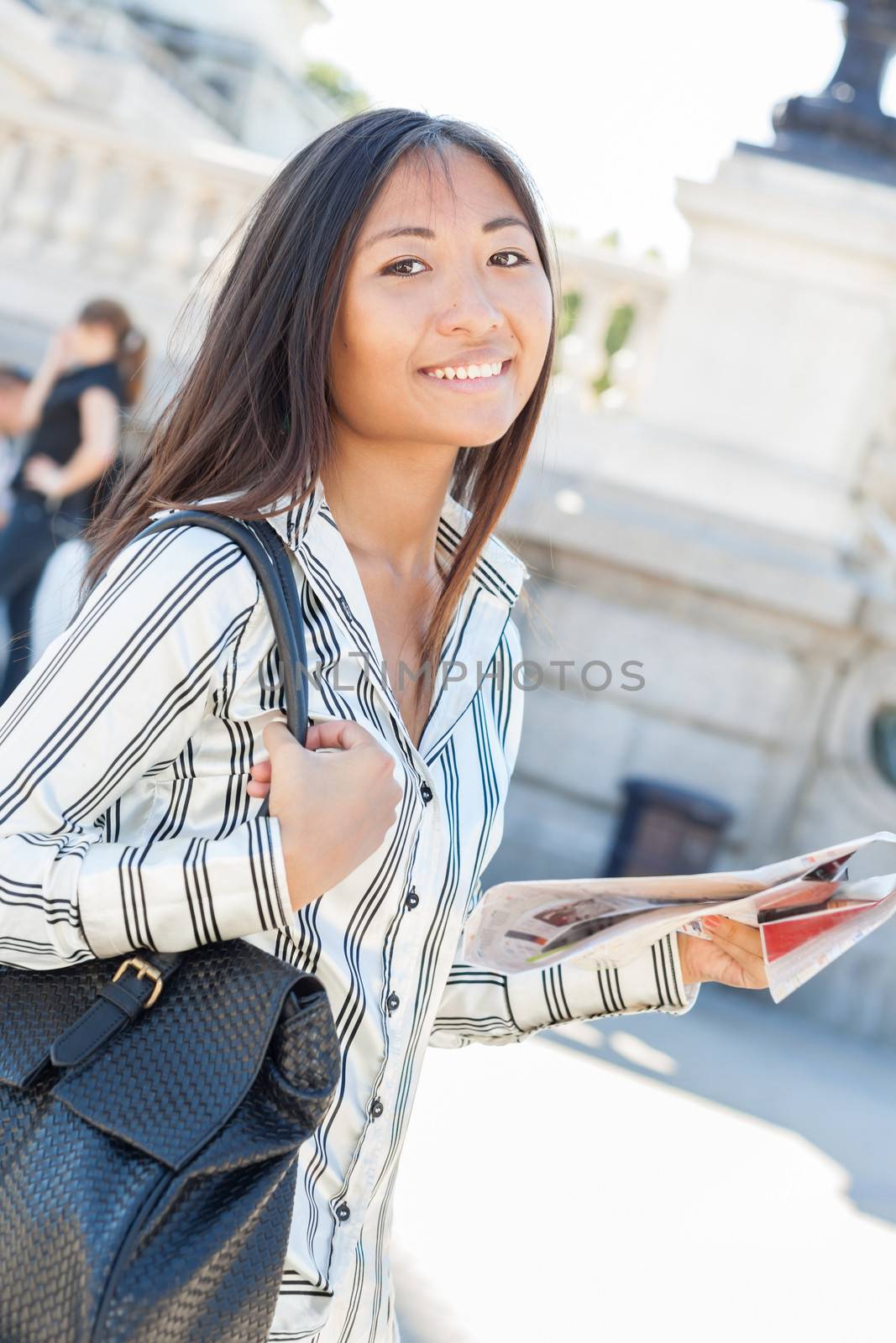 Pretty asian tourist holding a map  by TristanBM