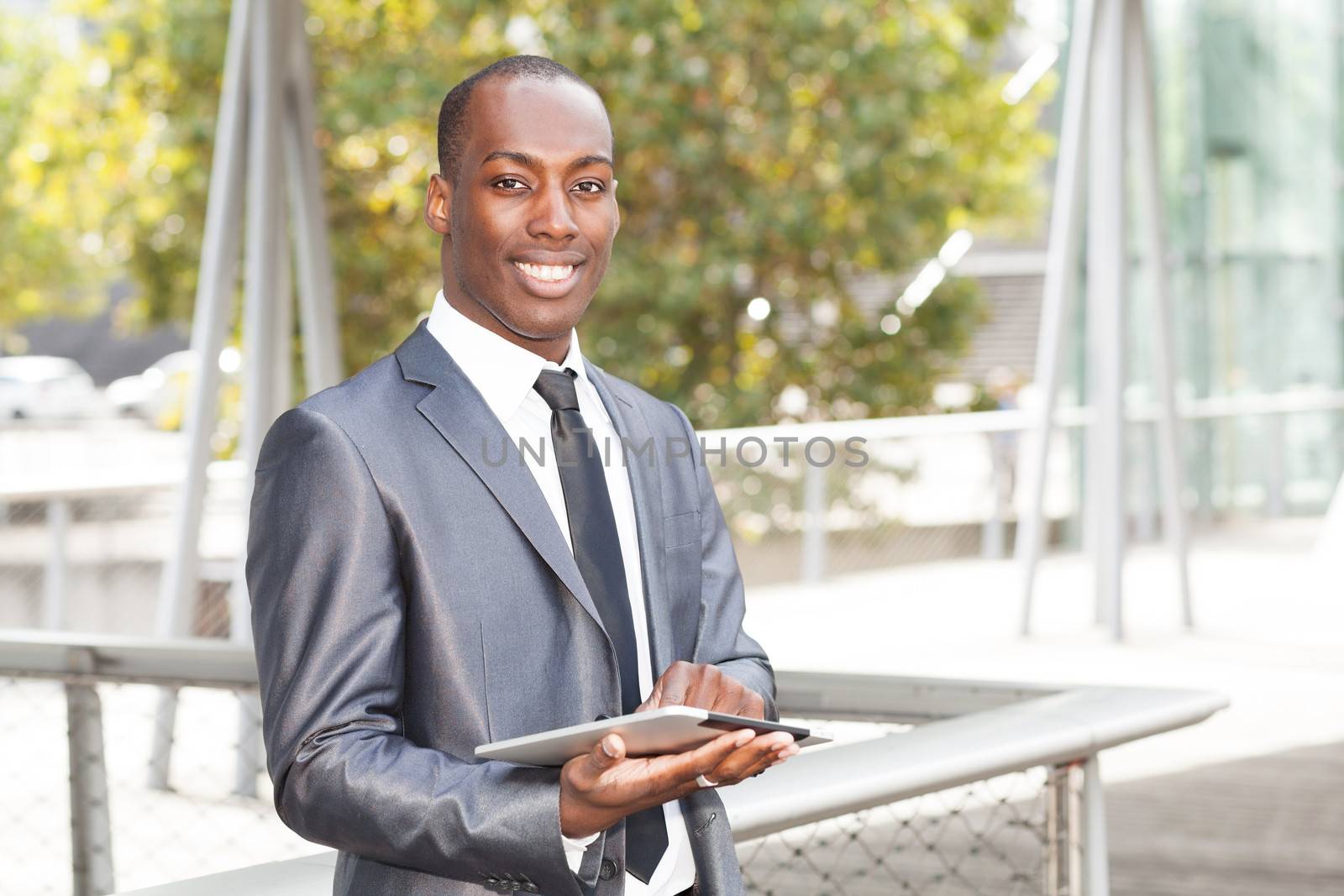 Portrait of a businessman working on electronic tablet