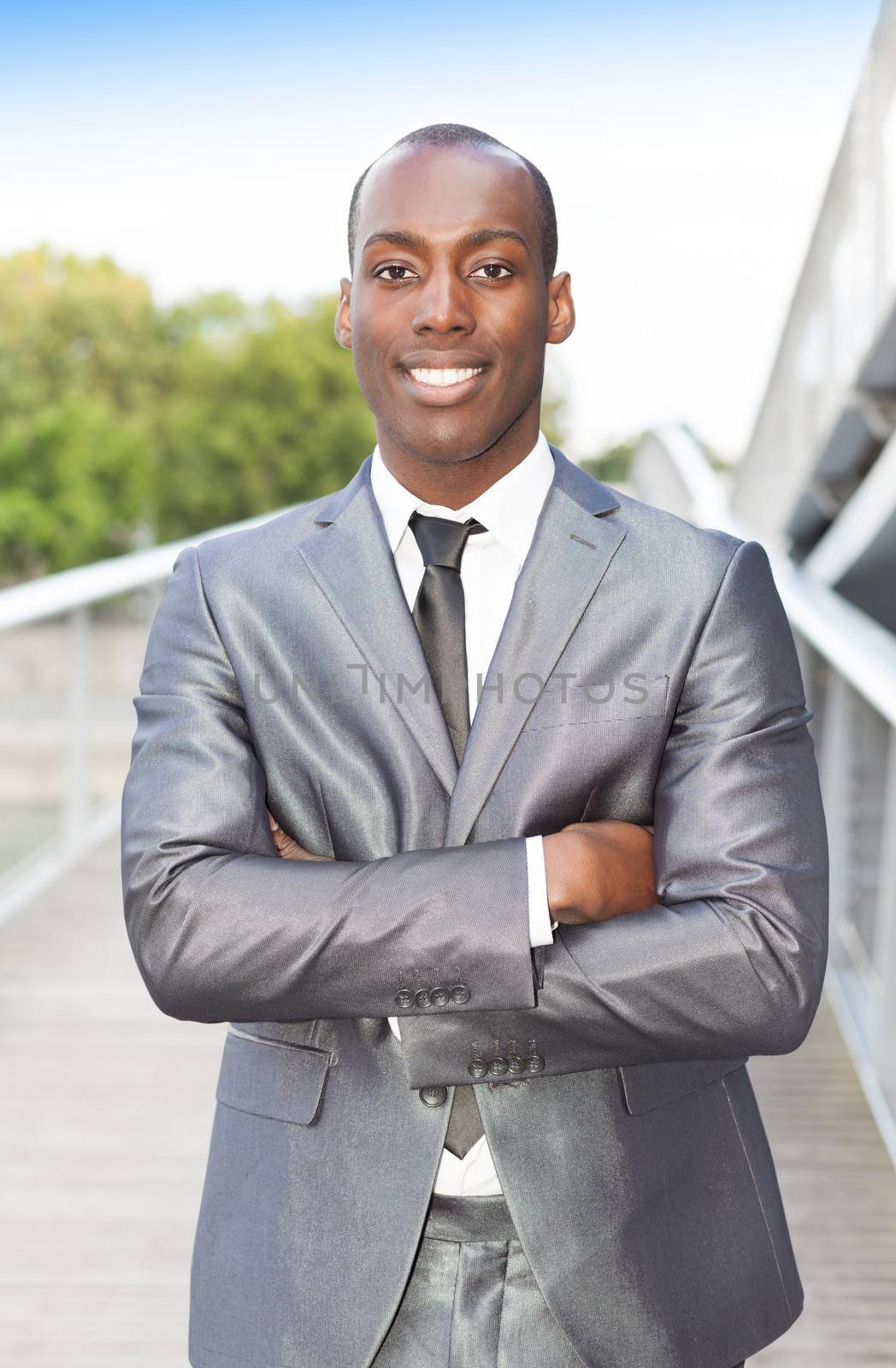 Portrait of a handsome businessman with arms crossed