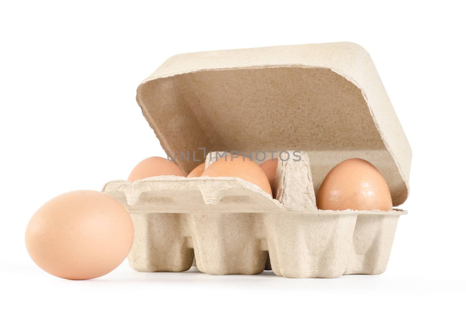 eggs in cardboard tray on white background with clipping path