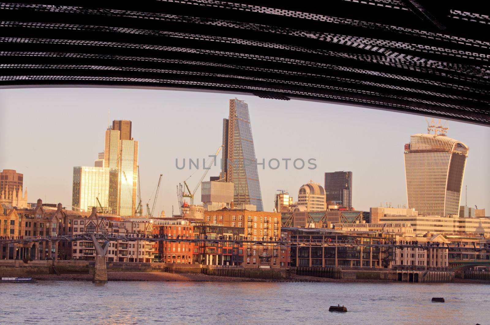 View of the River Thames and London's banking sector from underneath a bridge  