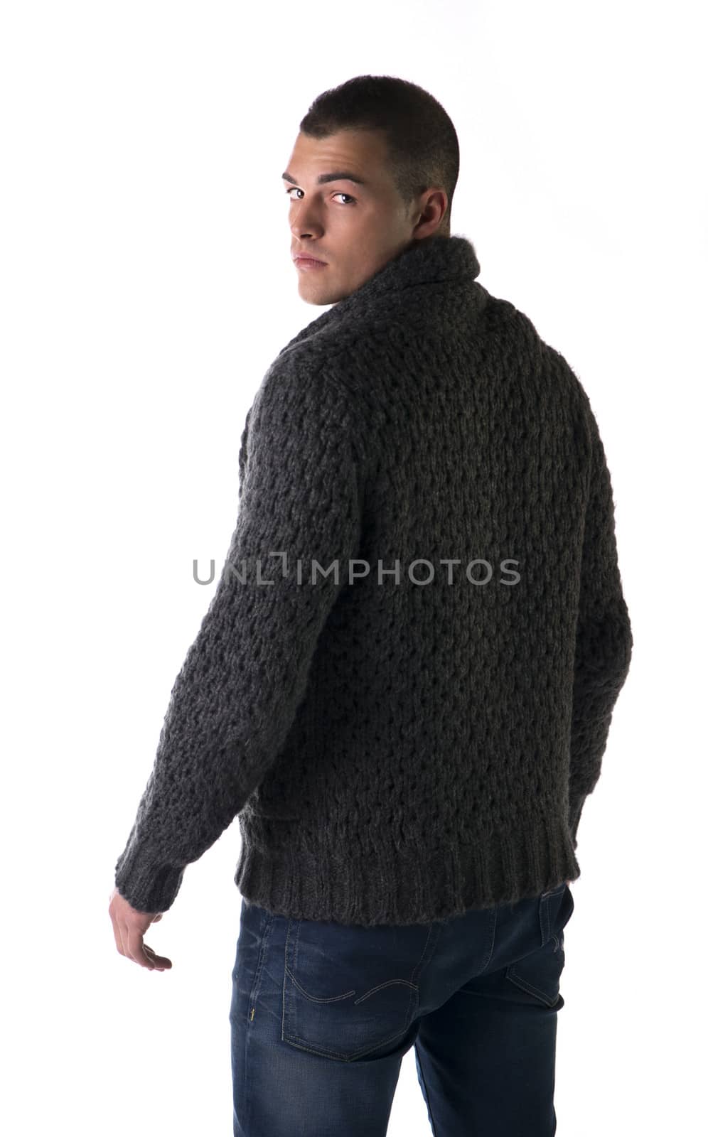 Back view of young man with wool sweater and jeans by artofphoto