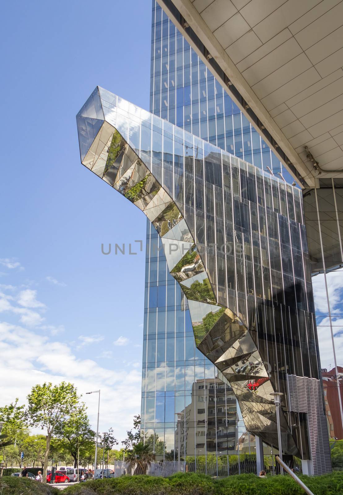 View of modern glass office building in Barcelona by doble.d