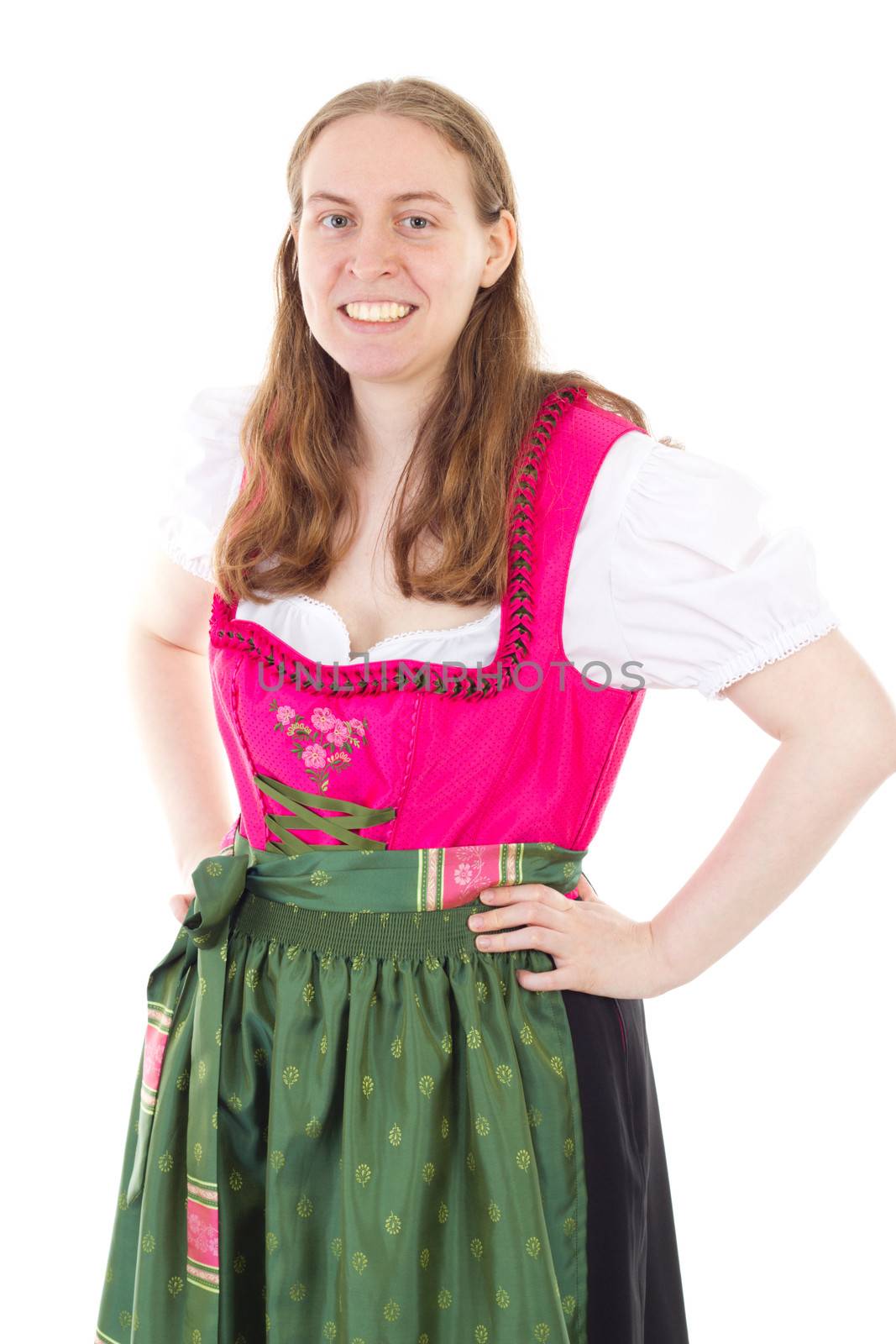 Beautiful and happy girl in dirndl smiling to you