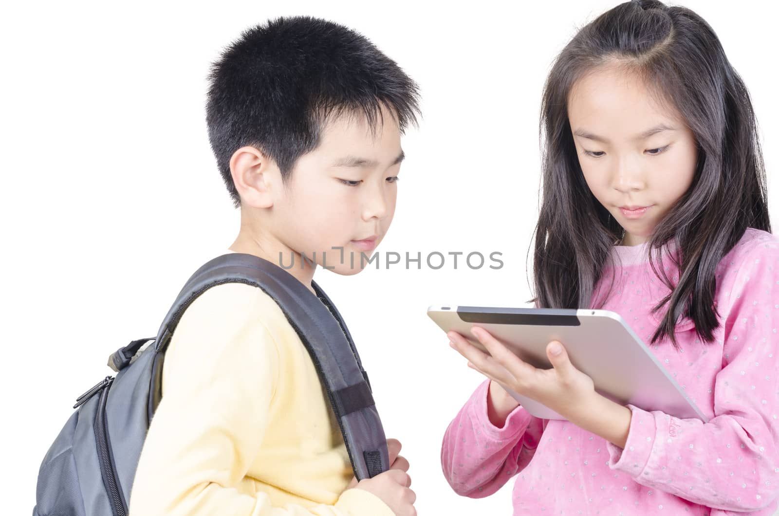 Smart children using touch pad computer and isolated on white