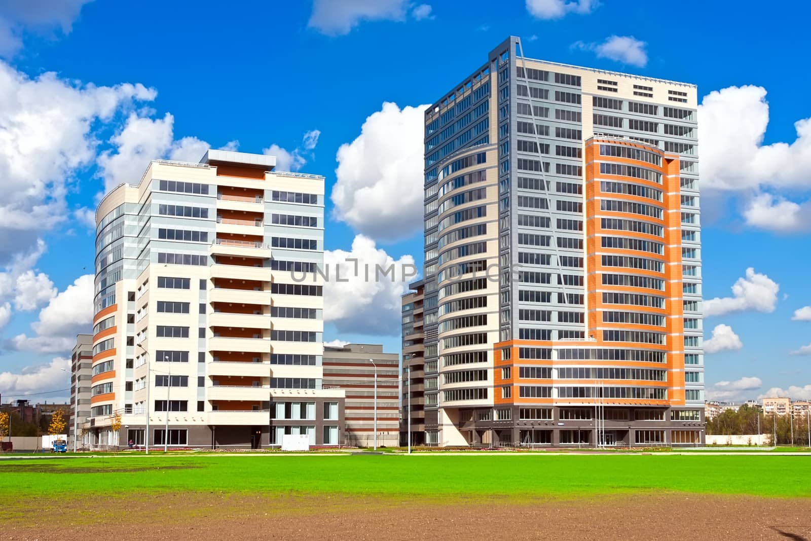 Beautiful view of modern apartment buildings under blue sky