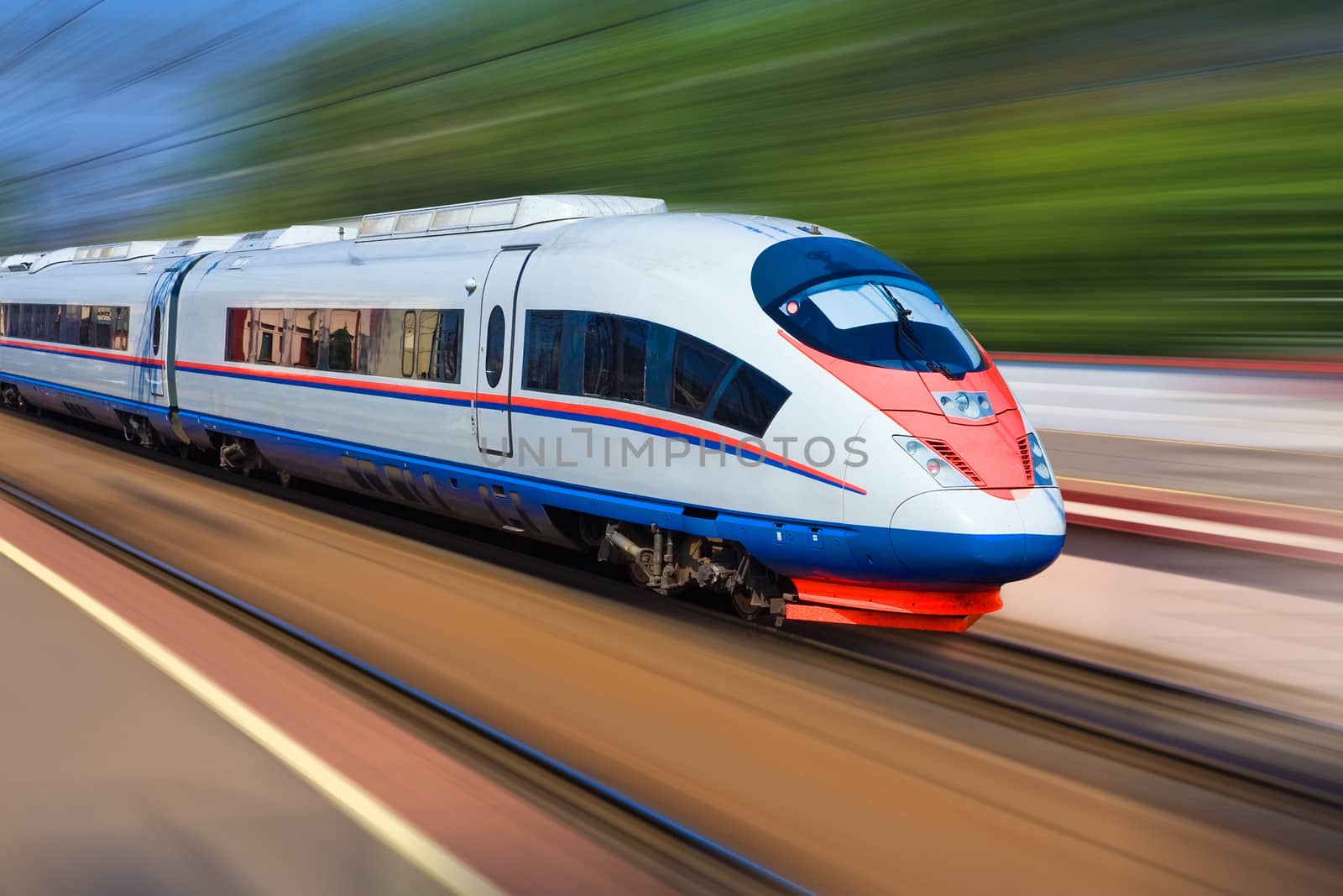 Beautiful photo of high speed modern commuter train, motion blur