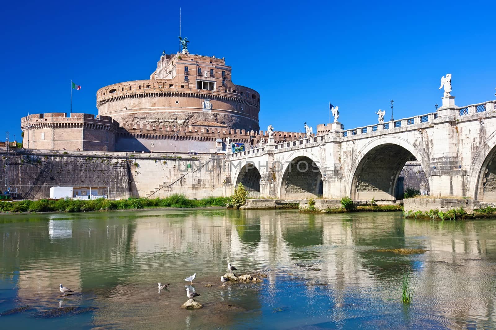 Famous Saint Angel castle and bridge over Tiber river in Rome, Italy