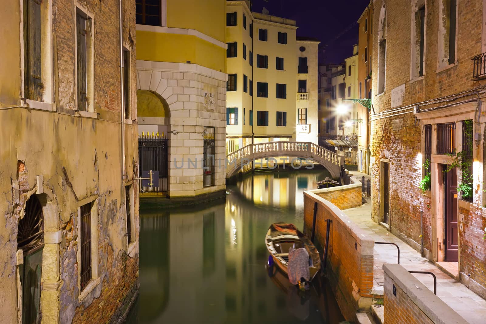 View of beautiful Venetian canal at night, Venice, Italy