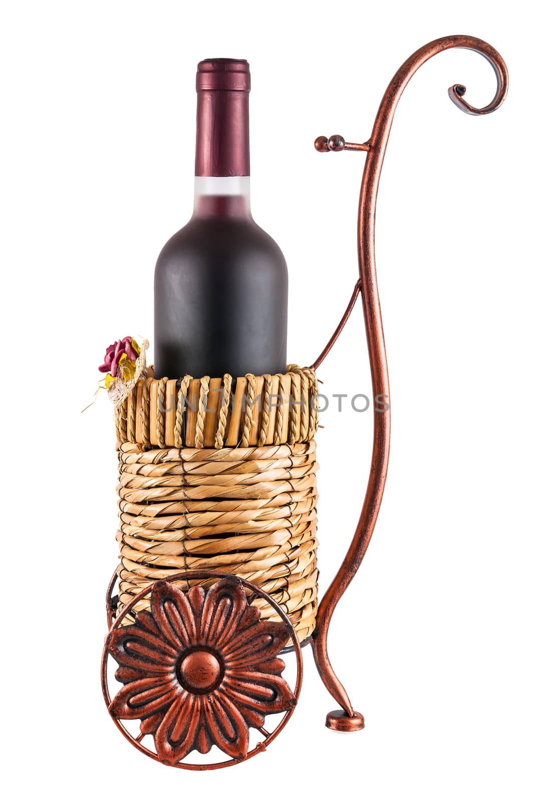 Bottle of red wine in wheeled basket isolated on white background with clipping path