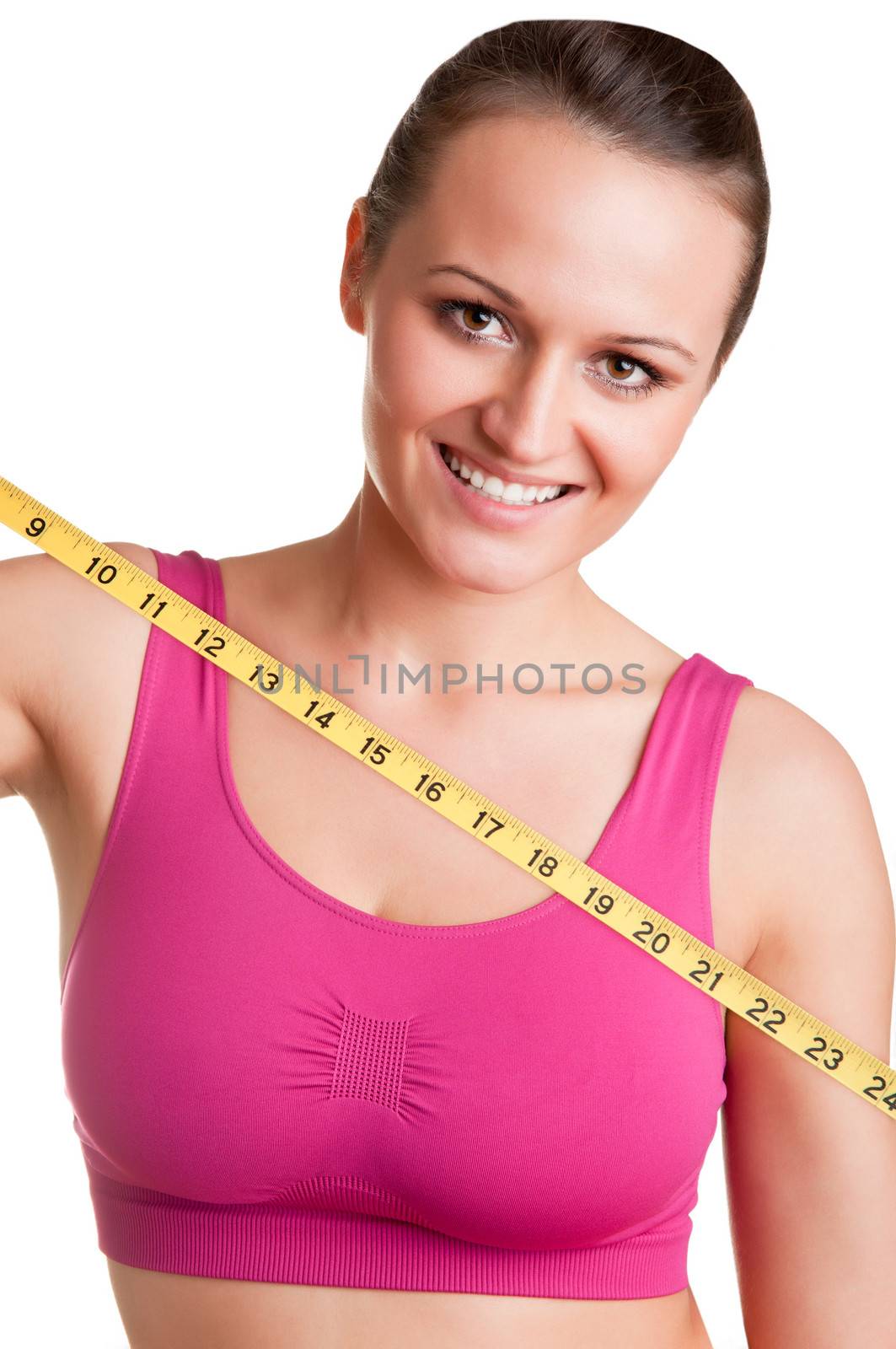 Woman holding a yellow measuring tape, isolated in white