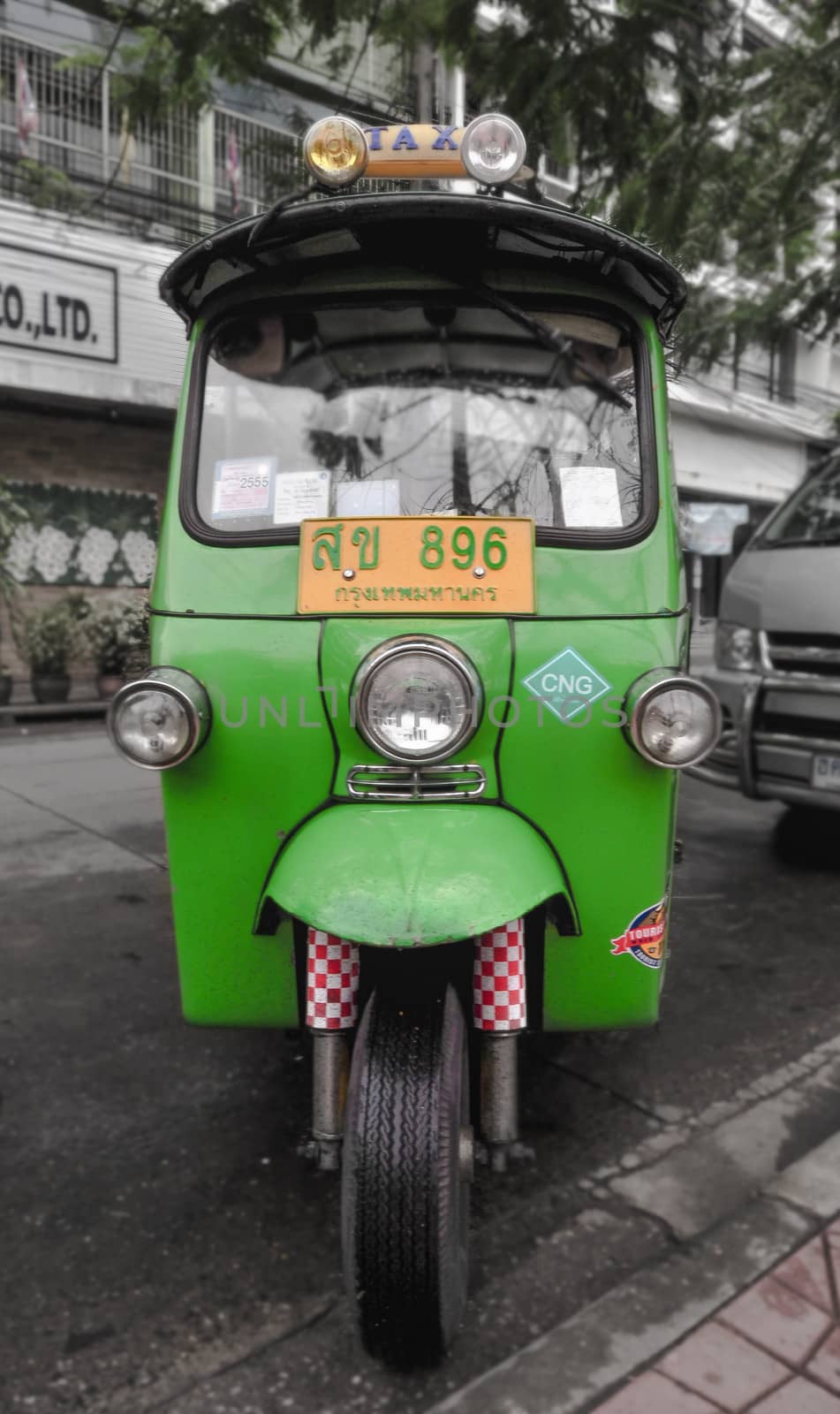 BANGKOK - JUNE 14: Tuk-tuk moto taxi on the street in the Chinat by weltreisendertj