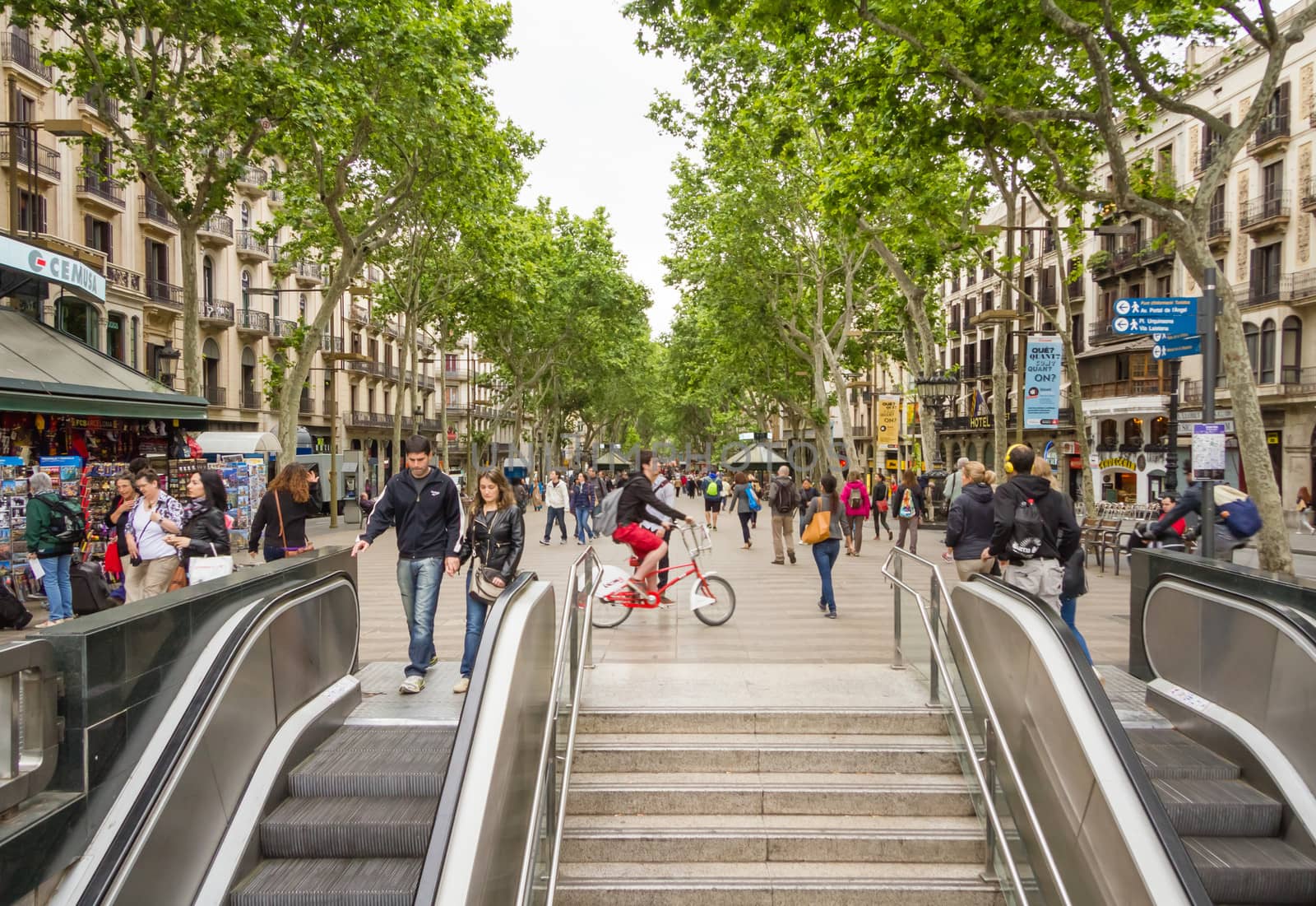 BARCELONA, SPAIN - MAY 31 People walking in the famous and touristic La Rambla street, in Barcelona, Spain, on May 31, 2013