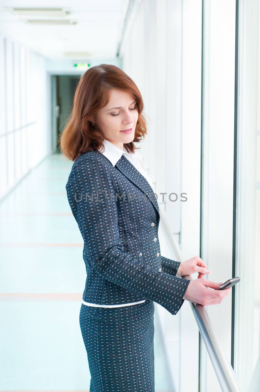 Beautiful business woman with phone by anytka