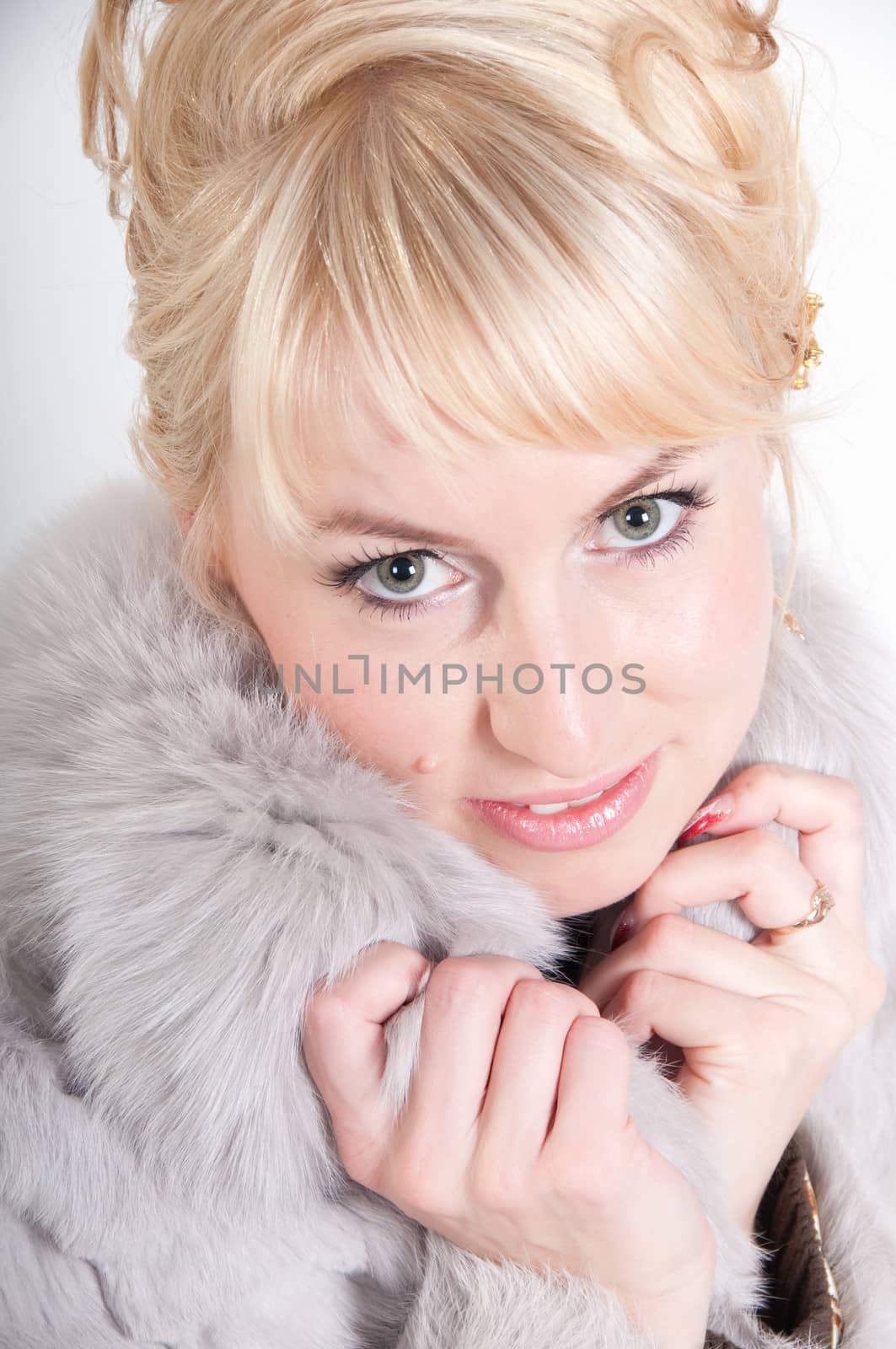 Portrait of beautiful woman in  fur cardigan