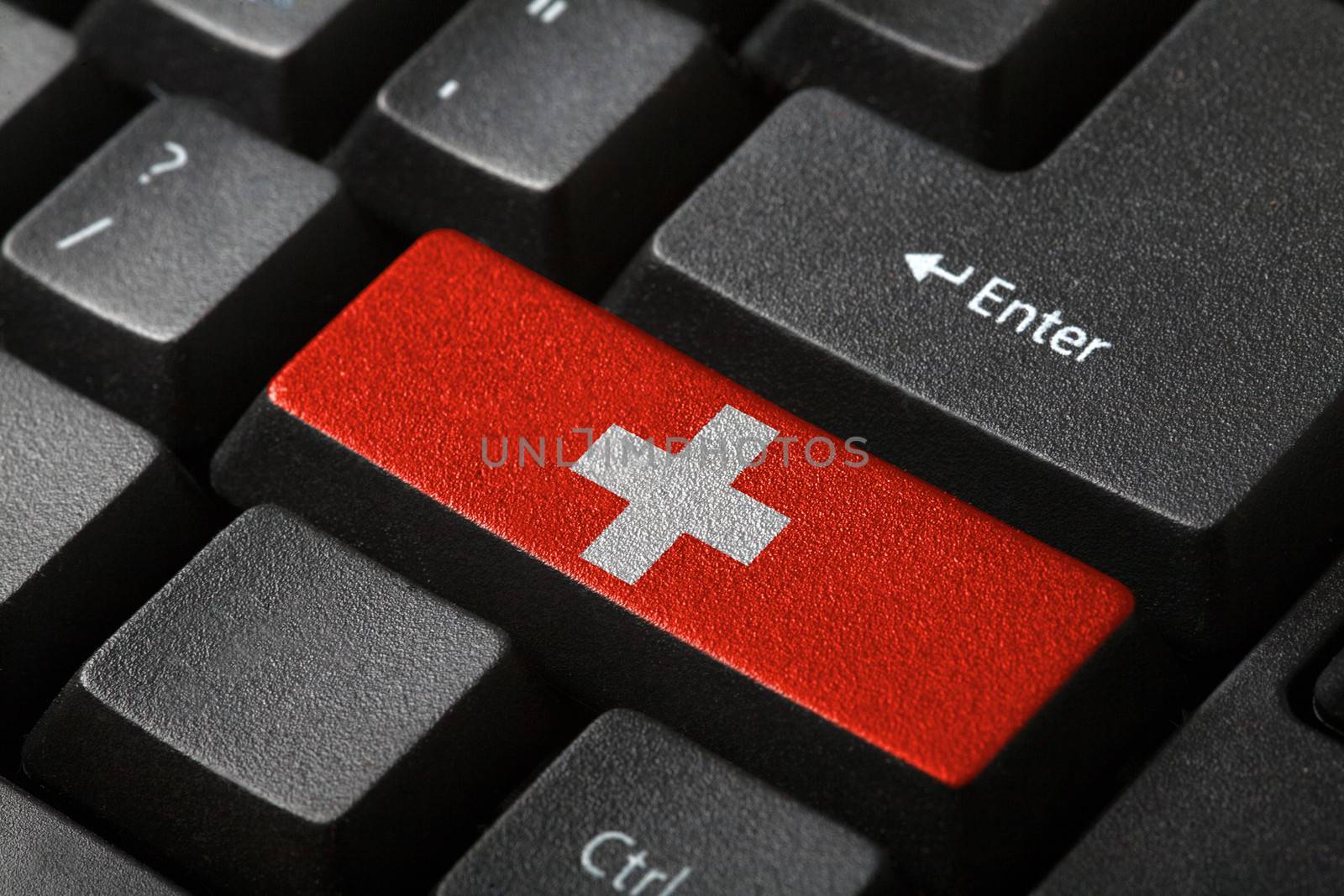 The Swiss flag button on the keyboard. close-up