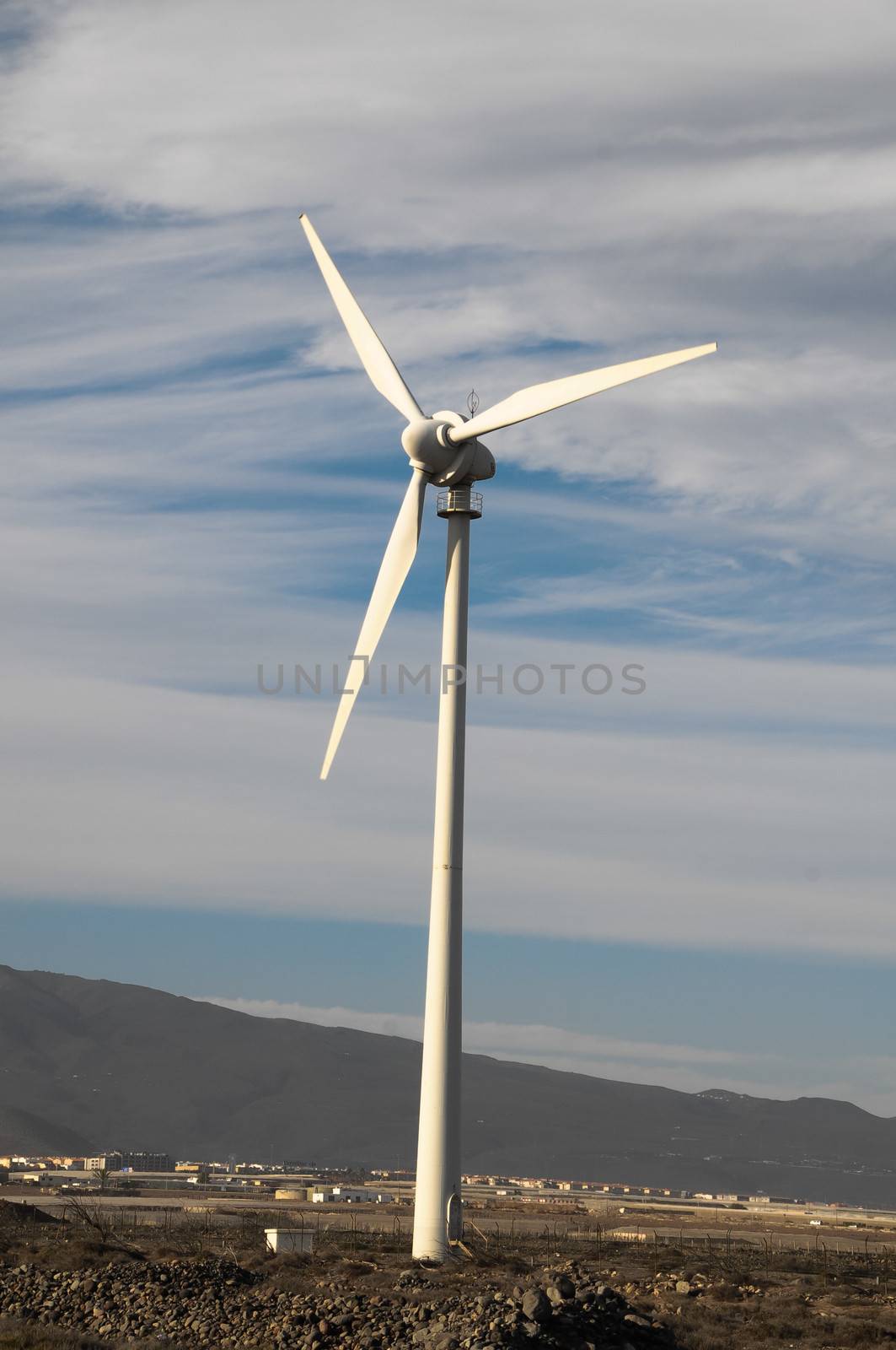 Eletric Power Generator Wind Turbine over a Cloudy Sky