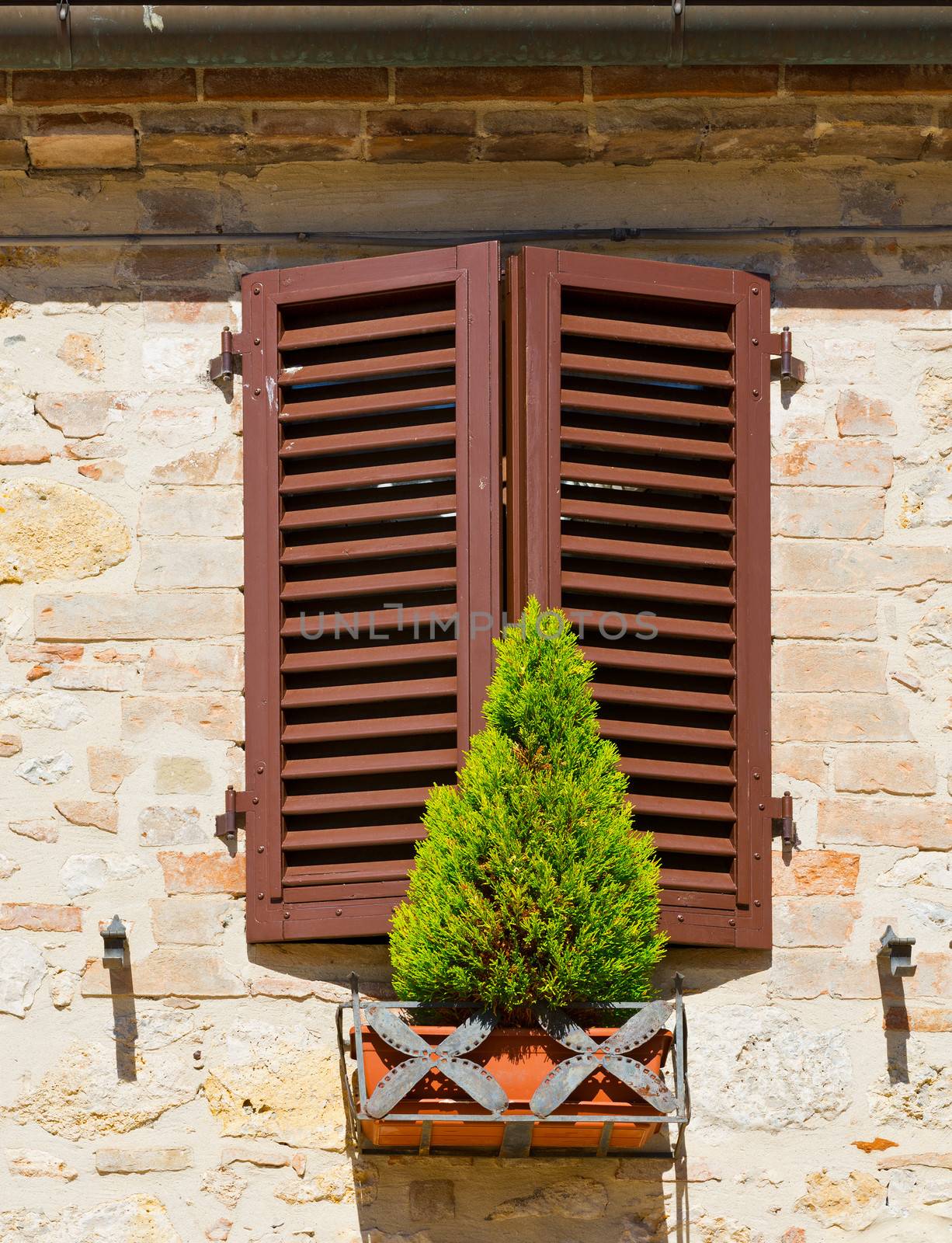 Window on the Facade of the Restored Italian Home