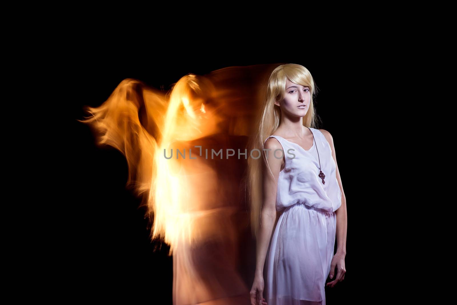 Behind the beautiful young girl with a fair hair the fiery angel by odindia