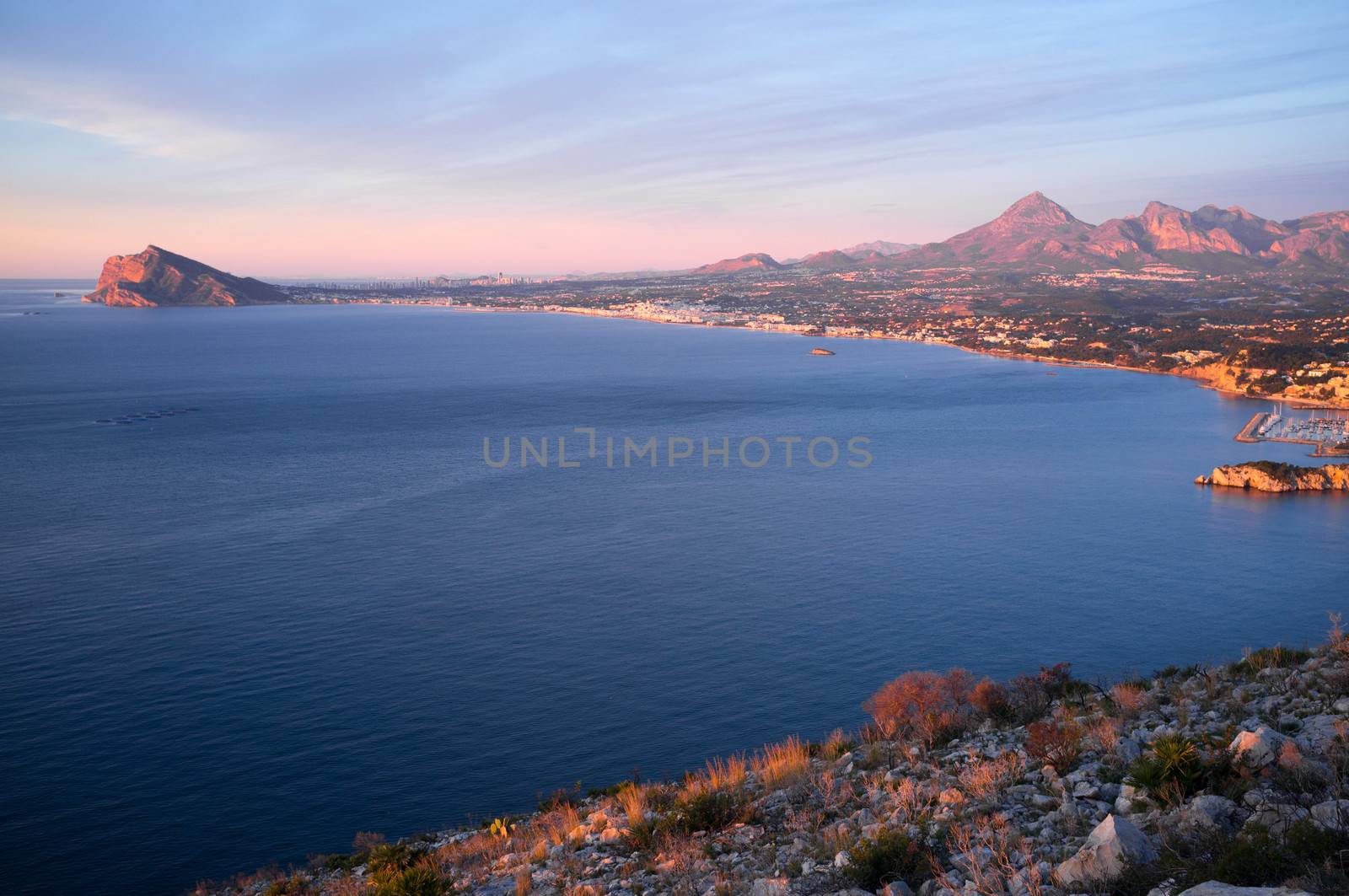 Altea bay with Benidorm resort in the background, Costa Blanca, Spain