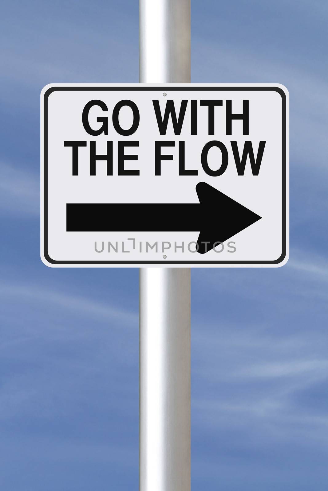 A modified one way street sign indicating Go With The Flow
