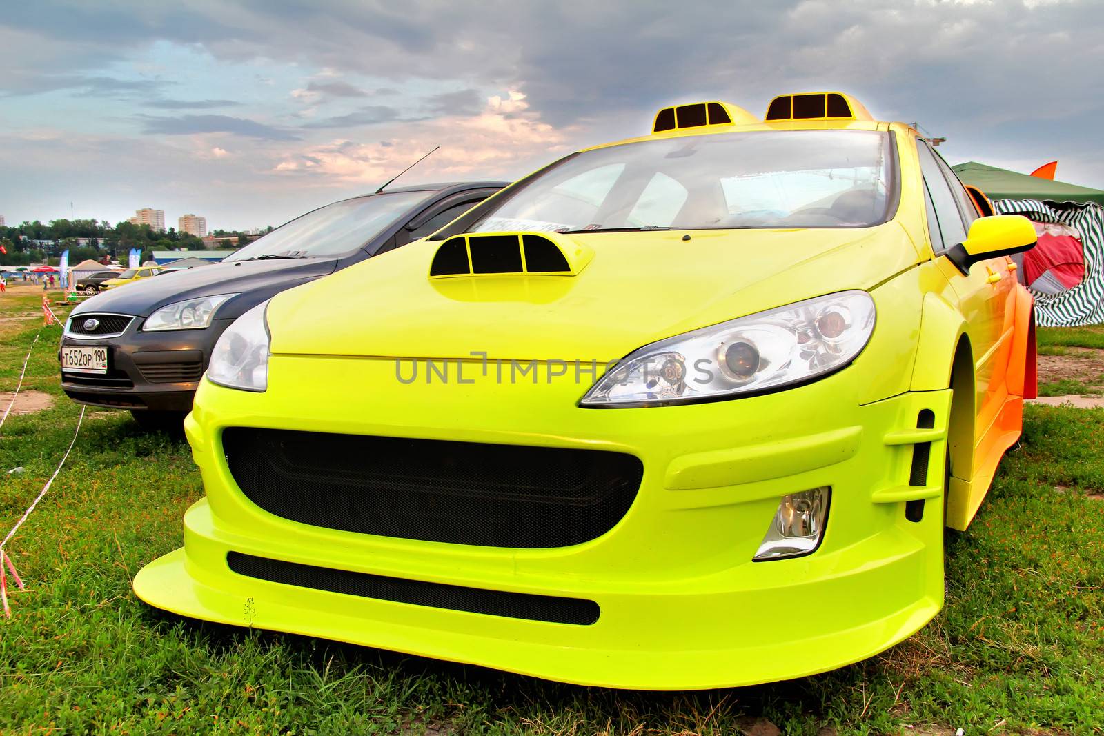 MOSCOW, RUSSIA - JULY 6: Tuned french motor car Peugeot 407 exhibited at the annual International Motor show Autoexotica on July 6, 2012 in Moscow, Russia.