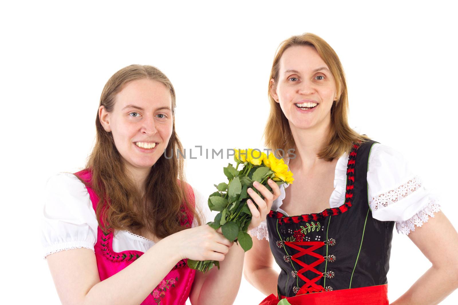 Beautiful and happy women in dirndl with bunch of roses by gwolters