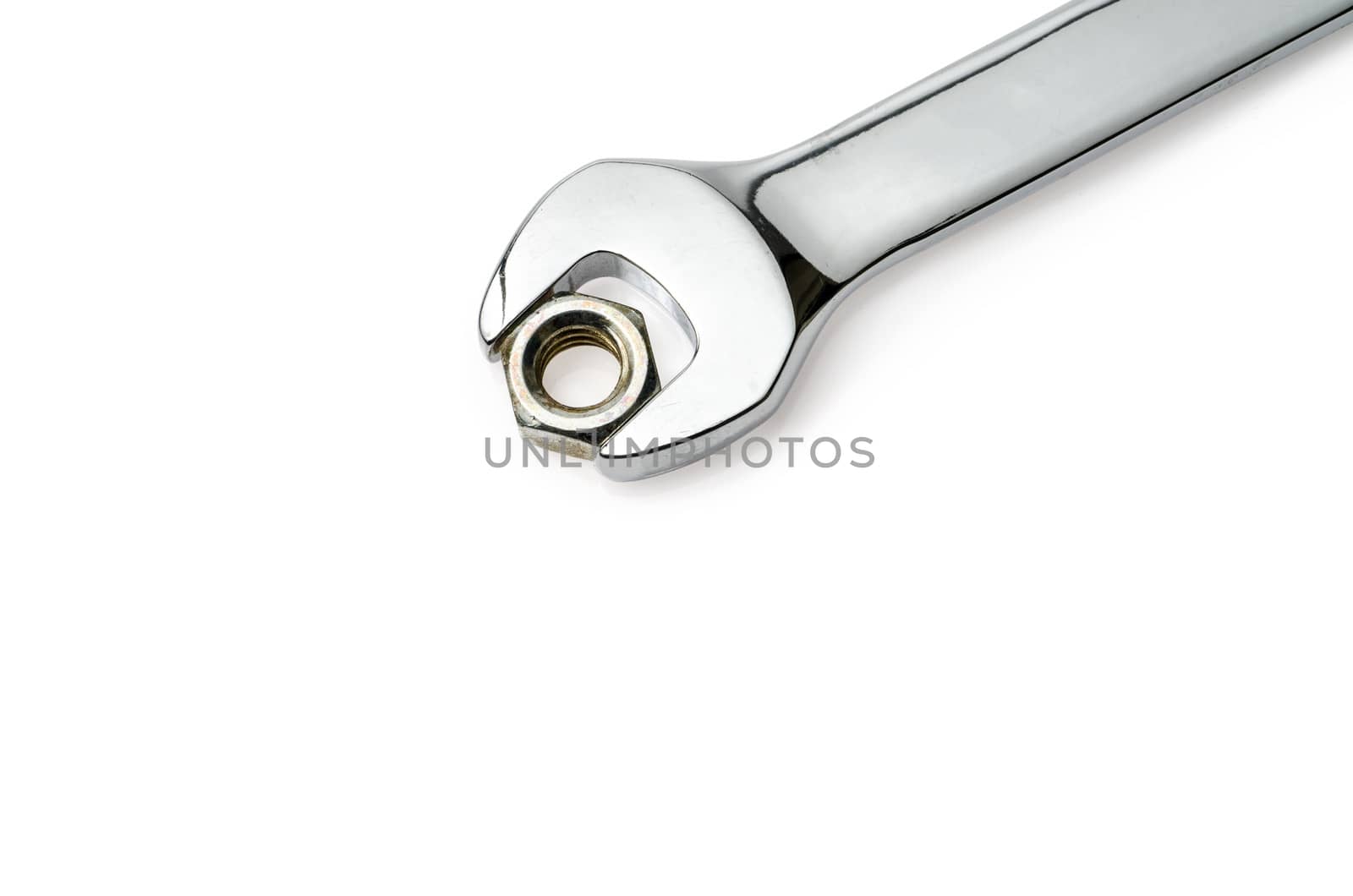 Wrench approaching nut. Very white background.