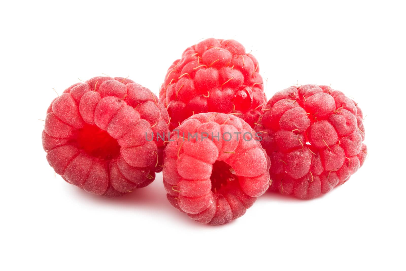 Ripe red raspberries isolated on white background