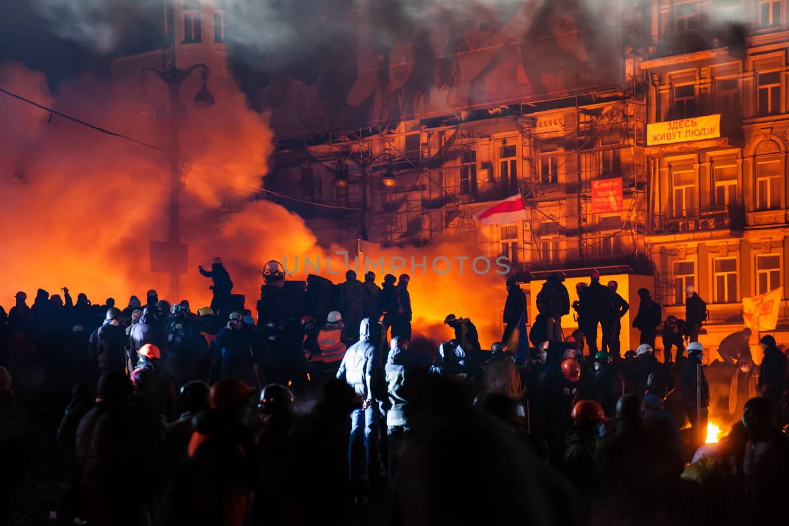 KIEV, UKRAINE - January 24, 2014: Mass anti-government protests in the center of the Ukrainian capital Kiev. Popular Resistance Warrior preparing to storm by government troops  on Hrushevskoho St.
 