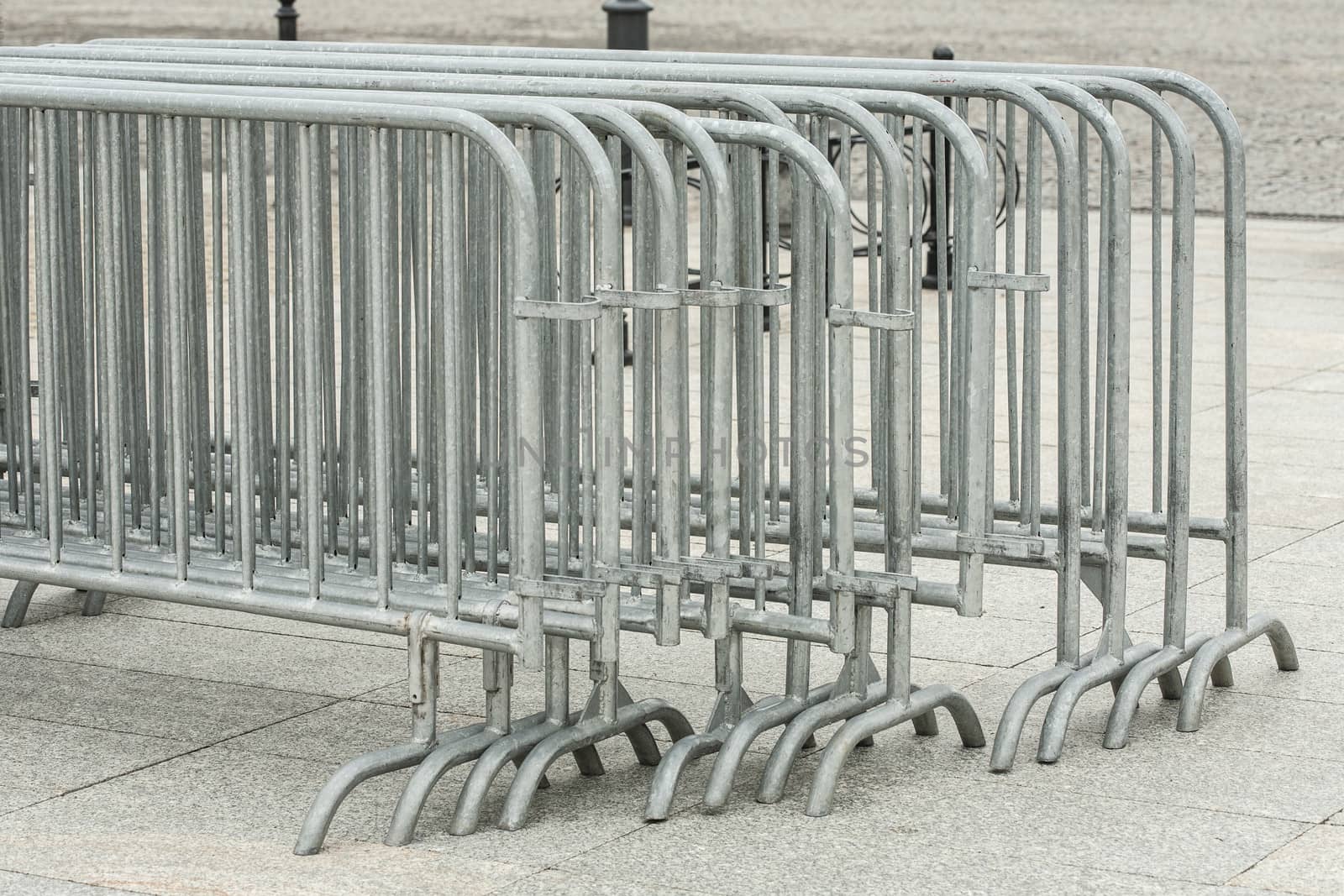 Metal barriers separating people at the concert, grouped into deployment.