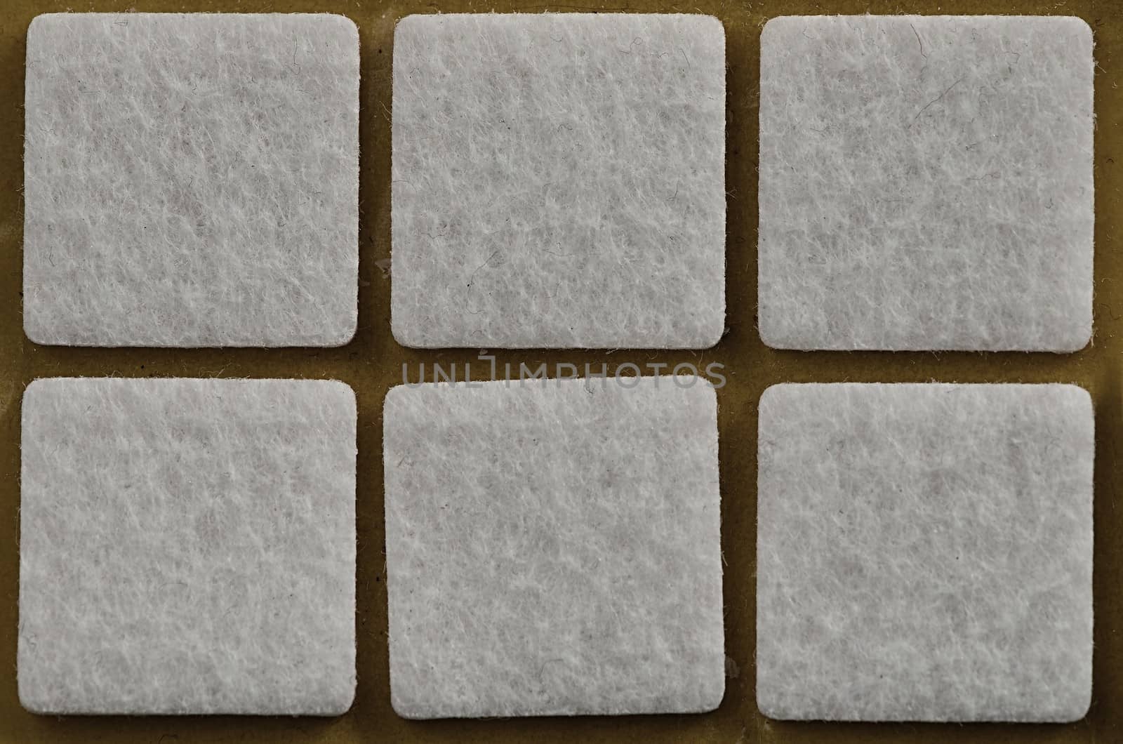 six white squares on a beige background 