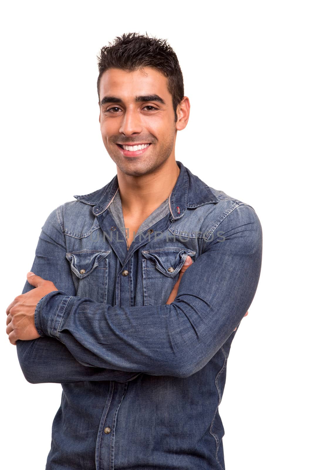 Casual young man with arms crossed and smiling by jolopes