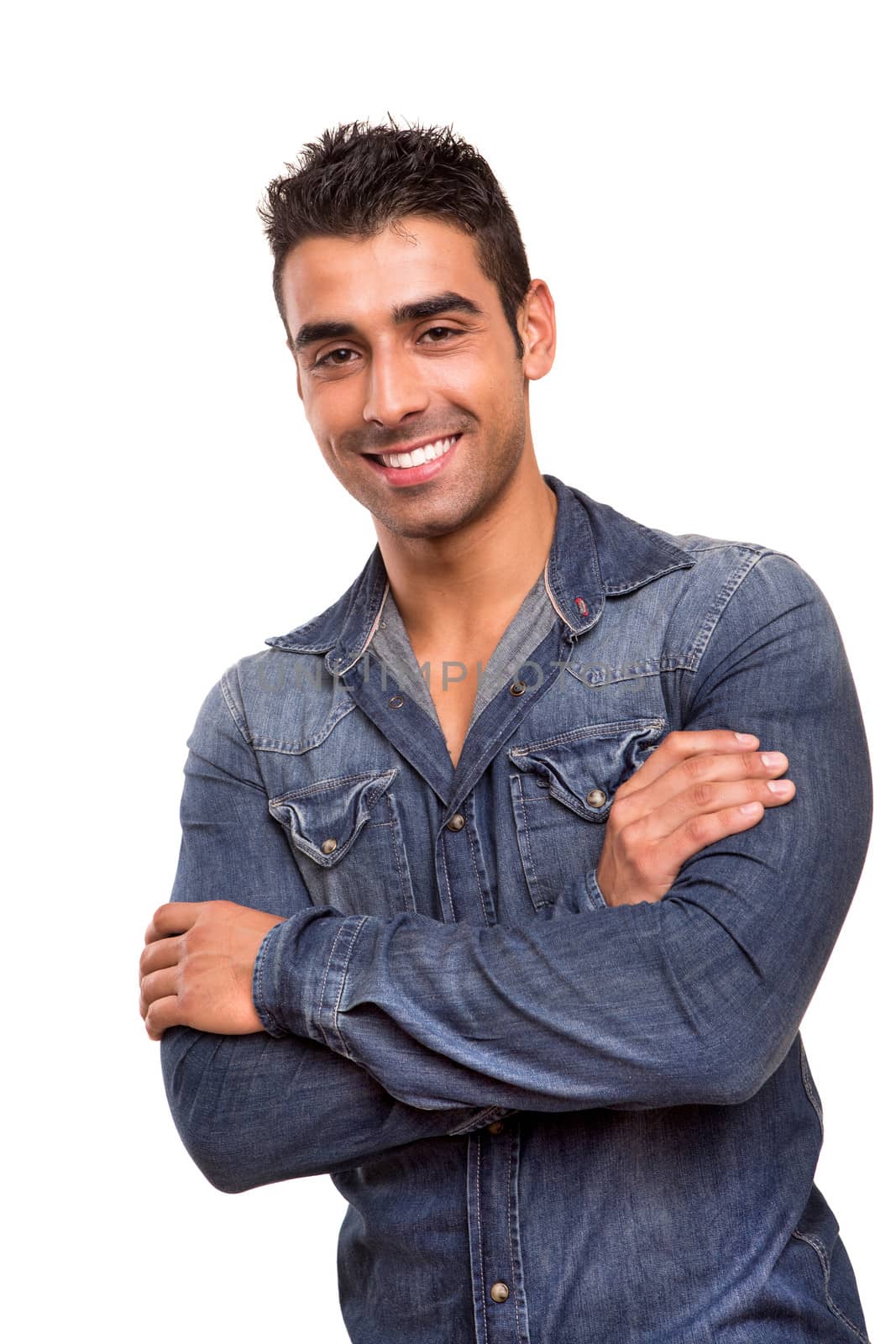 Casual young man with arms crossed and smiling