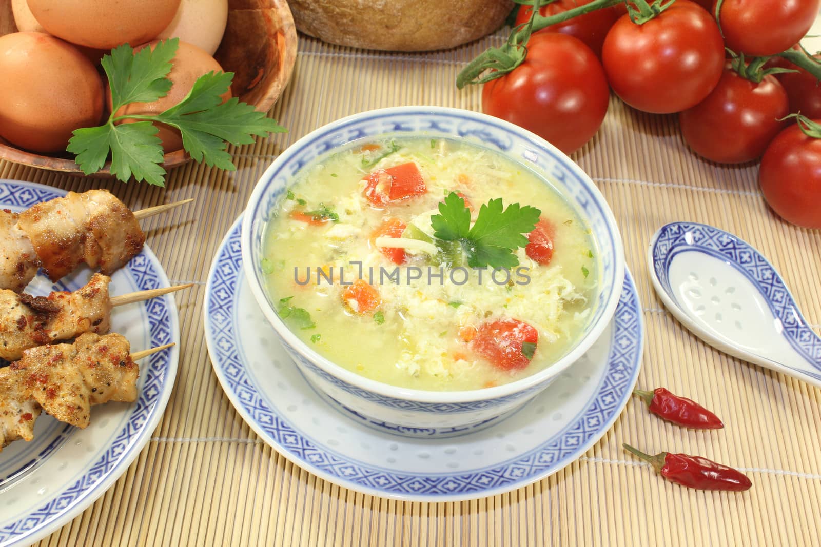 Asian Chicken soup with eggs, noodles and greens