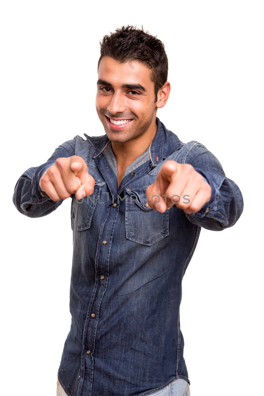 Portrait of a smiling young man pointing front